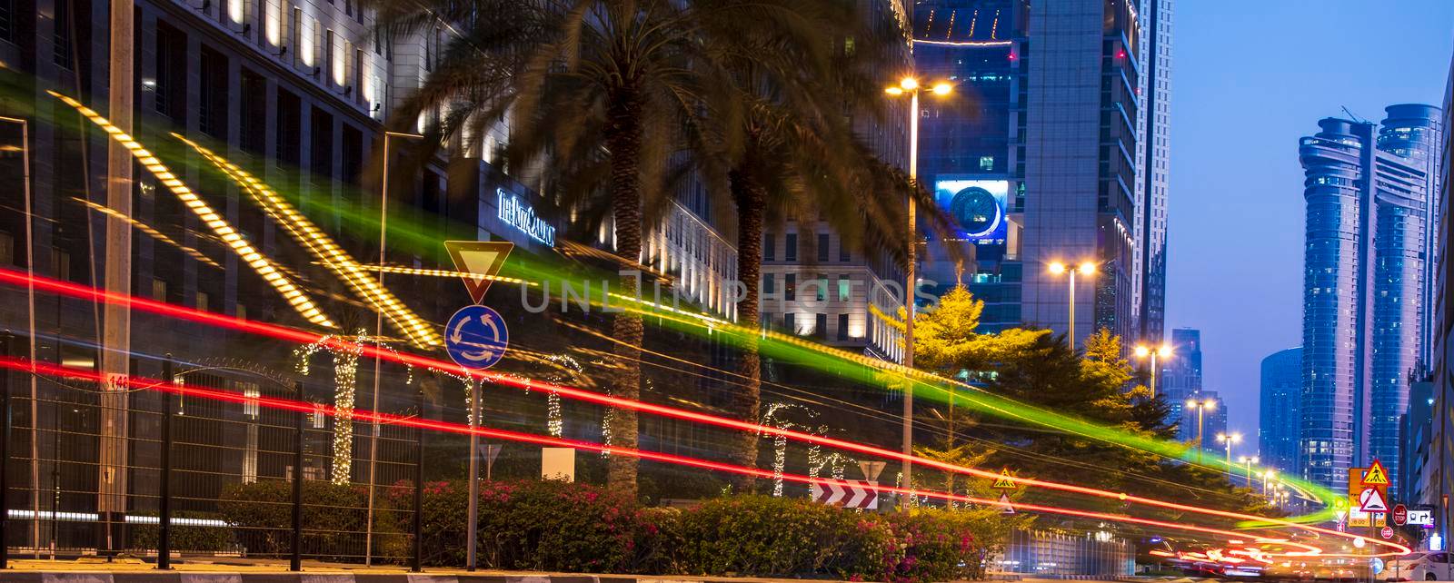 Light trails on Dubai Financial Center road. Address Sky view and Ritz Carlton hotel can be seen in the picture. Outdoors