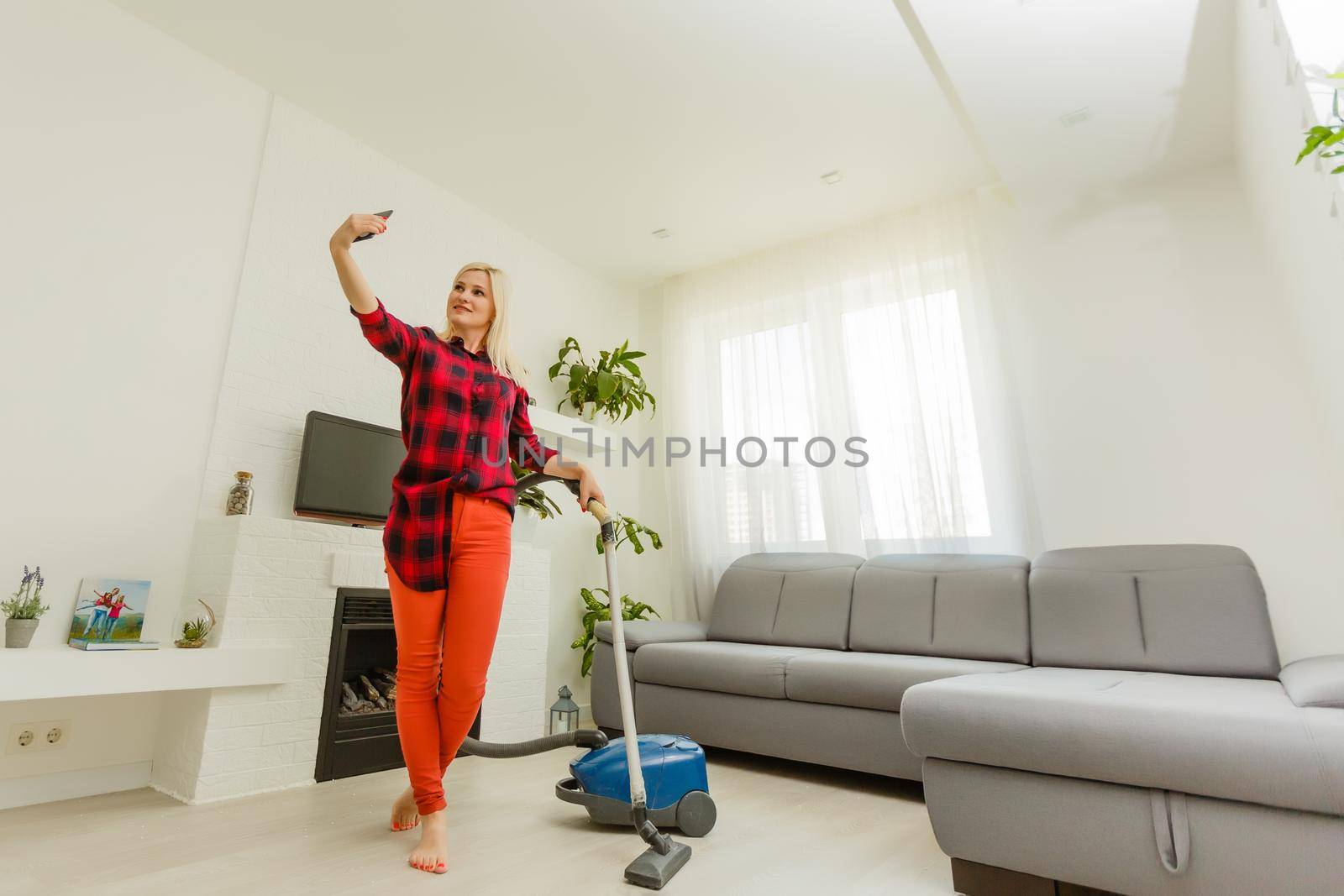 woman cleans the floor of the house by Andelov13