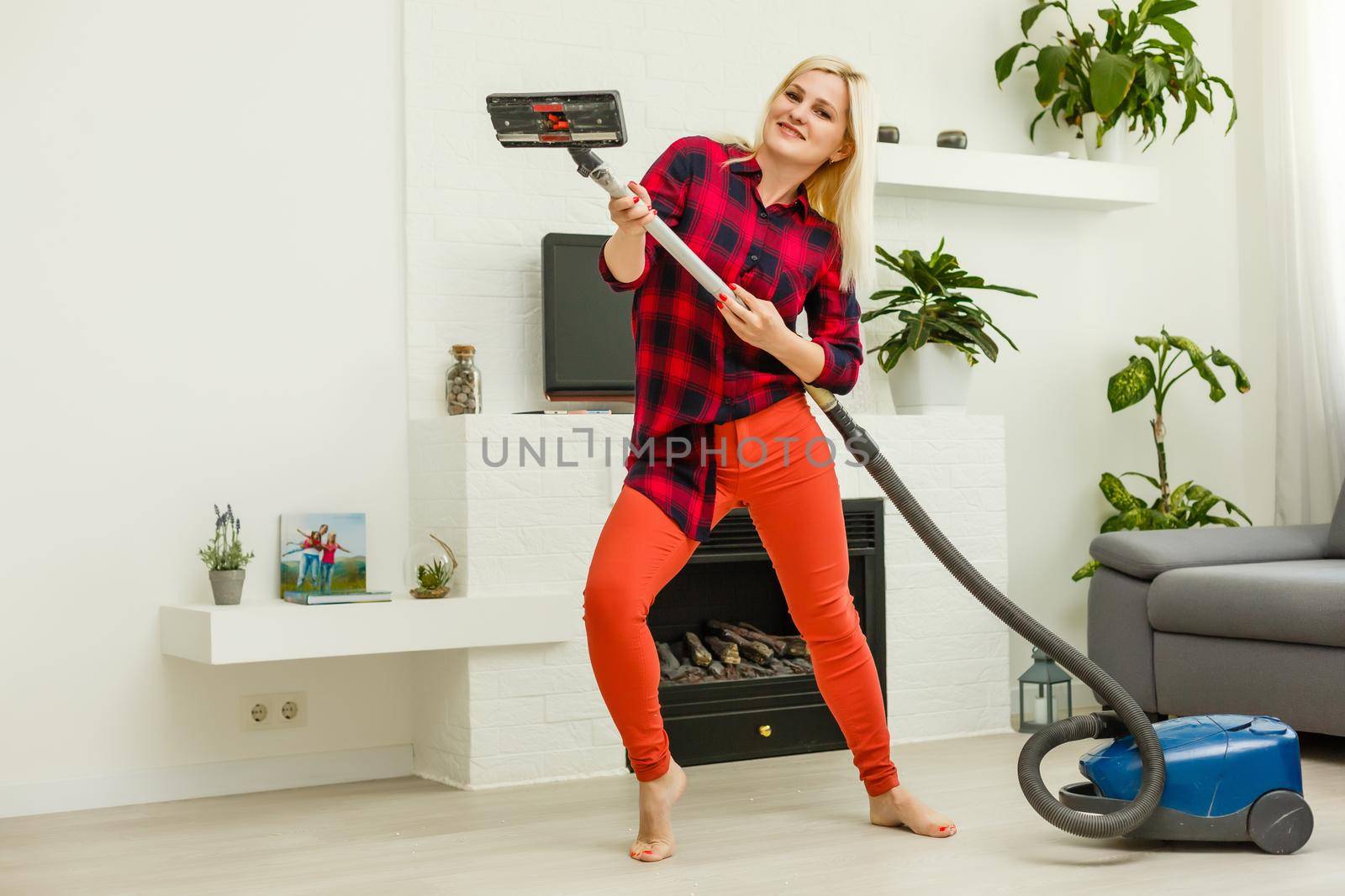 woman cleans the floor of the house