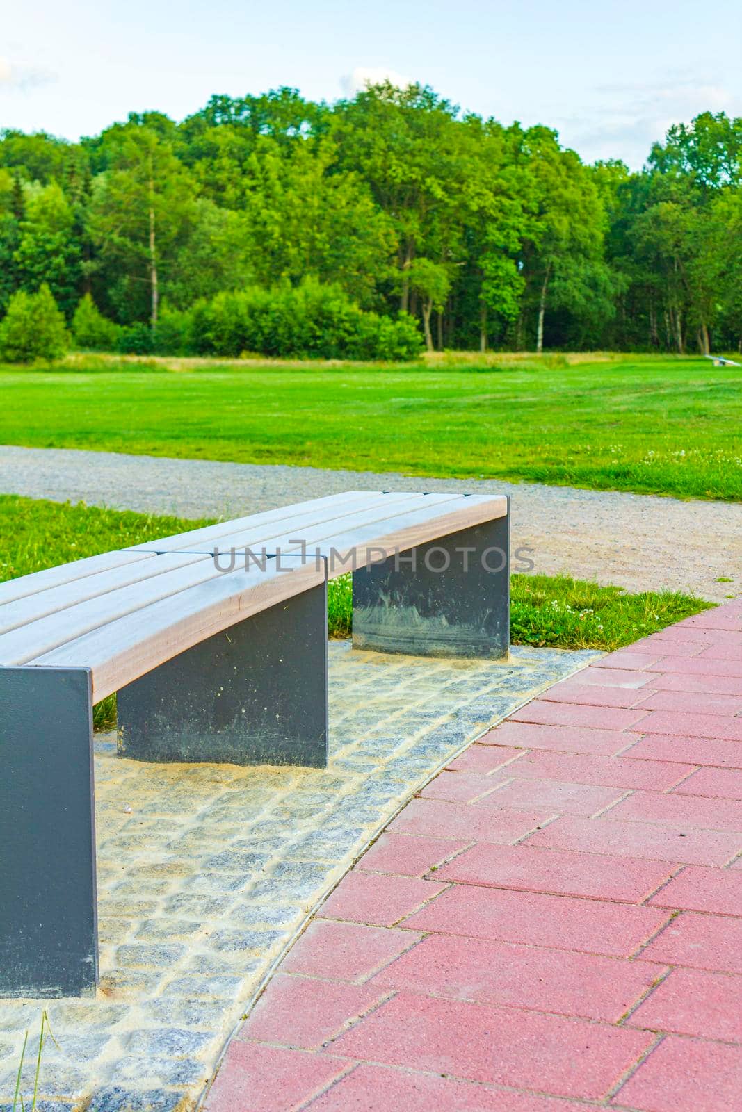 Natural beautiful panorama view with lake river walking pathway and green plants trees in the forest of Speckenbütteler Park in Lehe Bremerhaven Germany.