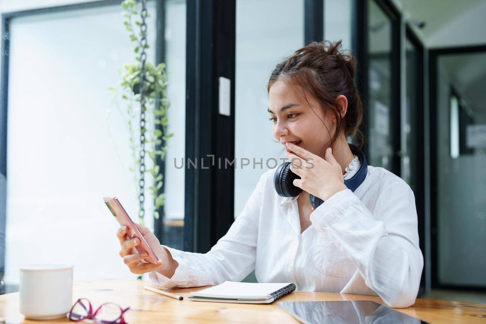 Portrait of a teenage girl using her phone to make video calls or call friends