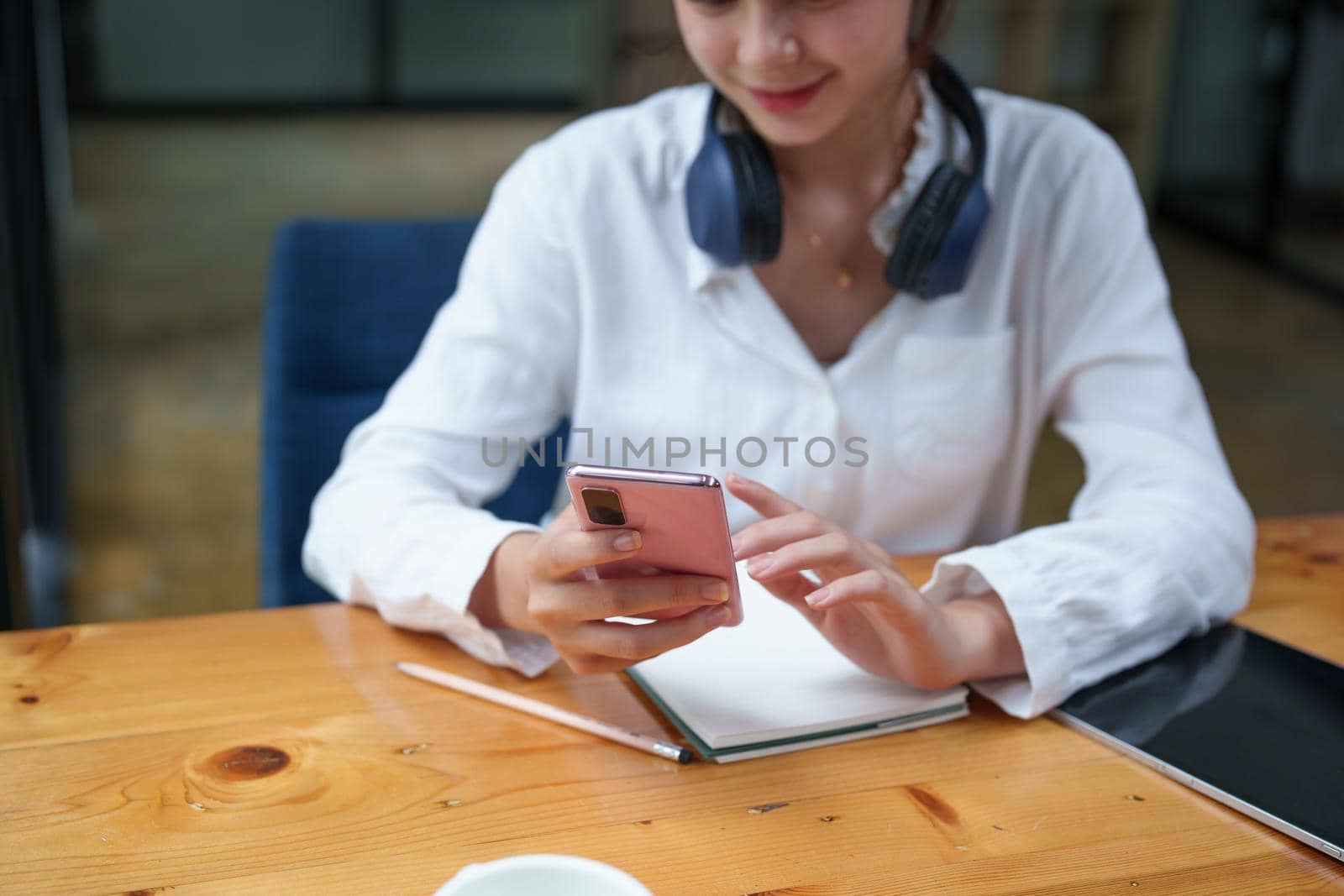 Portrait of a teenage girl using her phone to make video calls or call friends