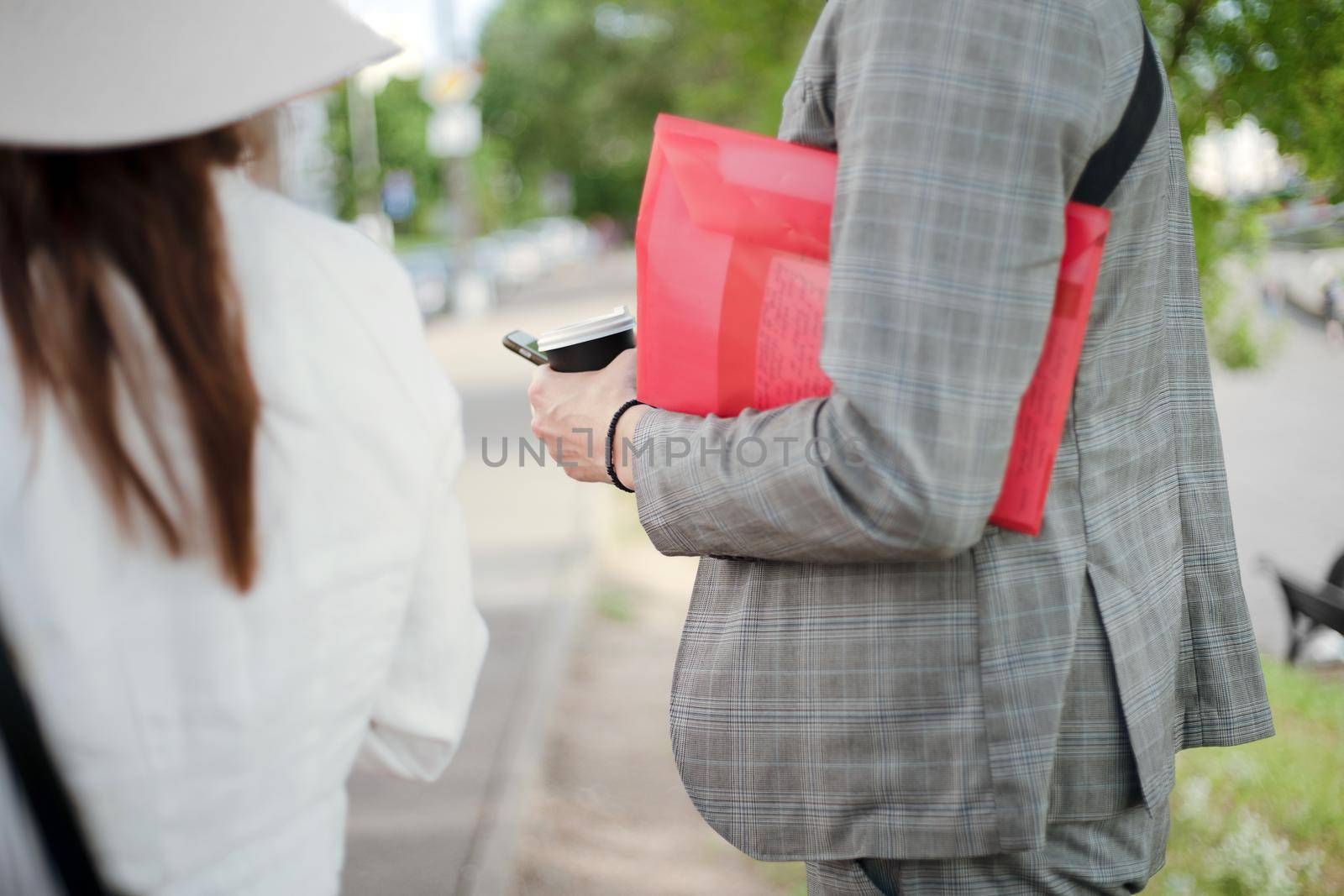 close-up. image of a group of tourists and a tour guide standing on a city street.