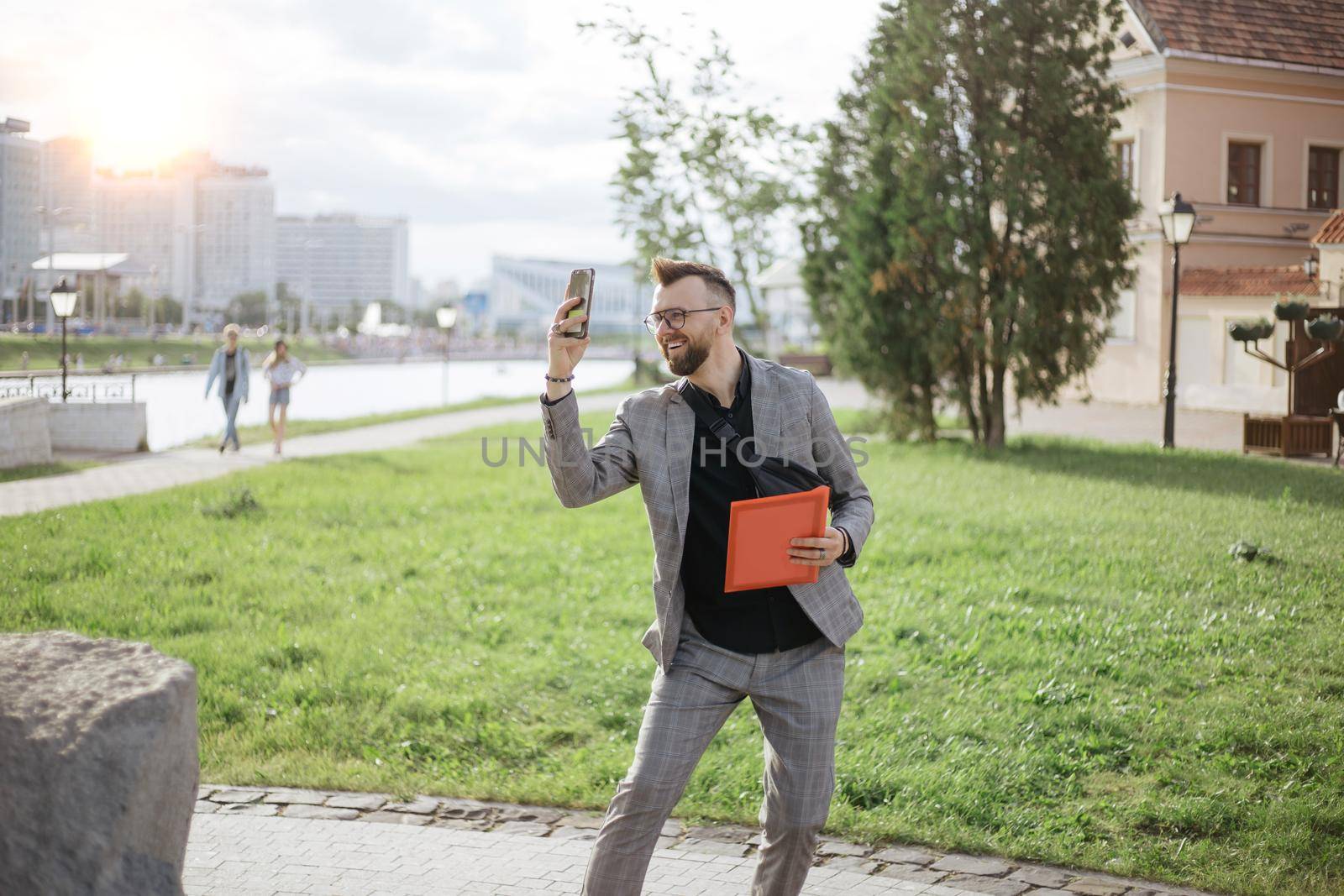 male tourist taking a selfie during an excursion. by SmartPhotoLab