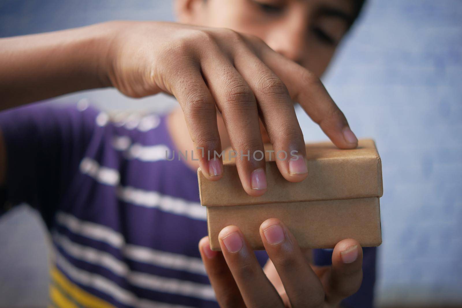 teenage boy open a empty small gift box ,