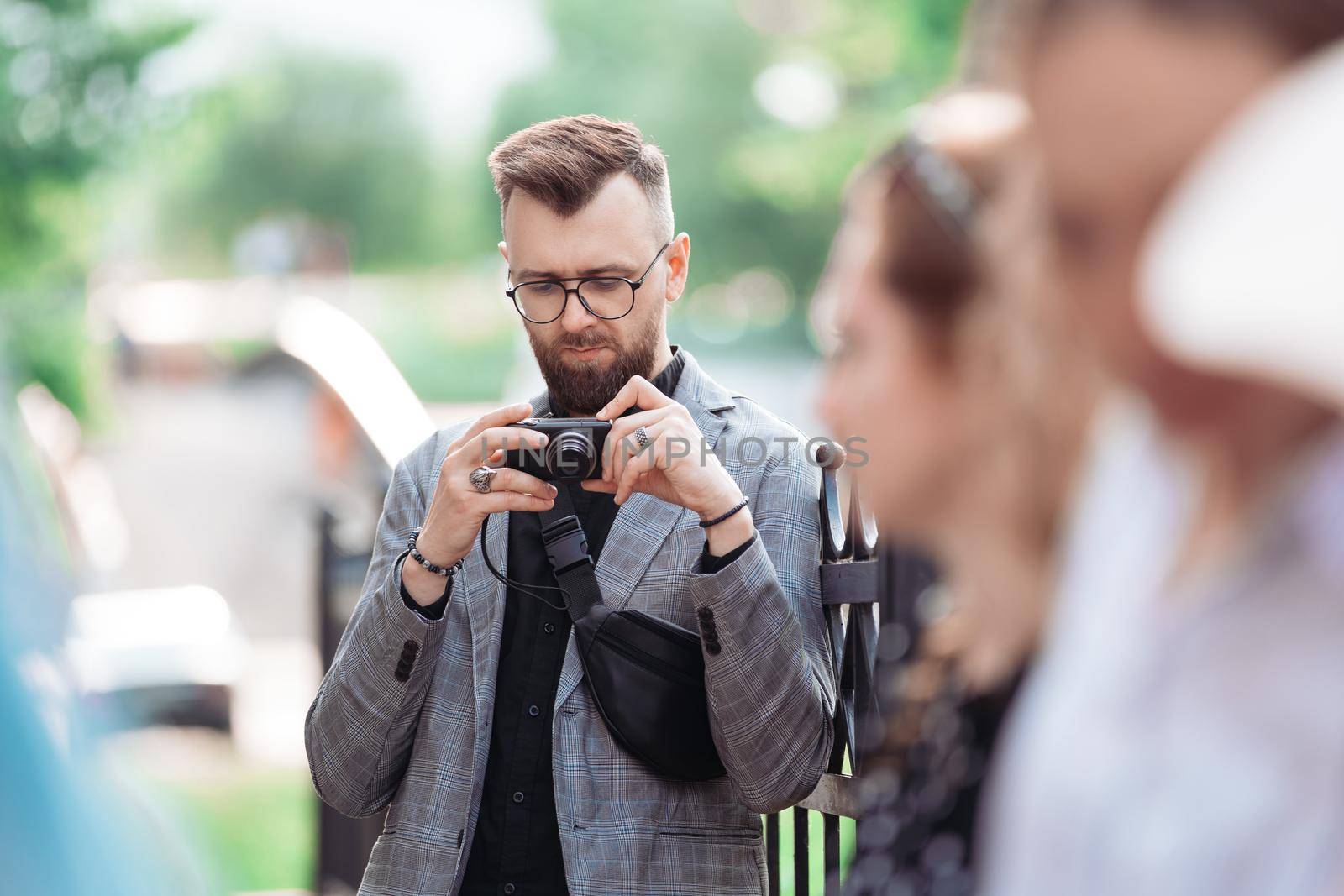 male tourist is viewing a photo on his camera. close-up.