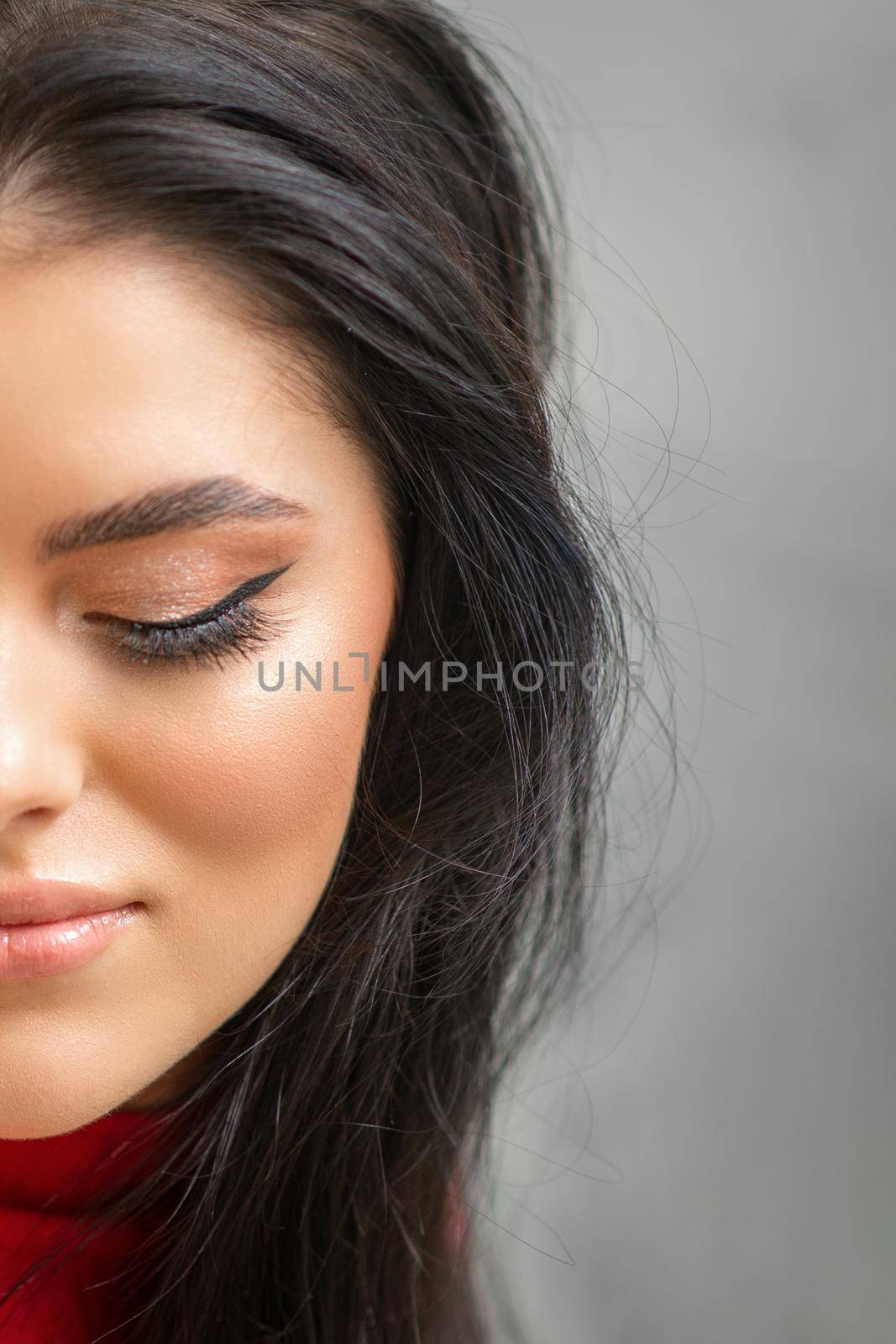 Portrait of young beautiful woman with long lashes and closed eyes after eyelash extensions