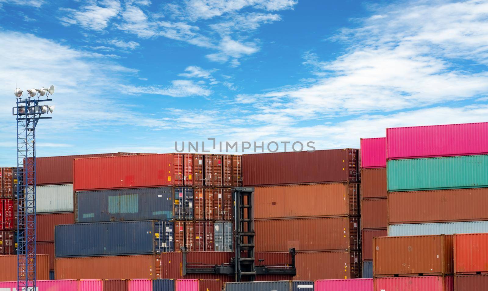 Stack of logistics container. Cargo and shipping business. Container ship for export logistics. Logistic industry. Container for truck, ship, and air logistics. Container depot service and transport.