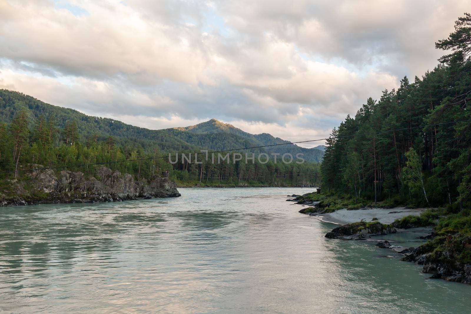 A fast-flowing wide and full-flowing mountain river. by AnatoliiFoto