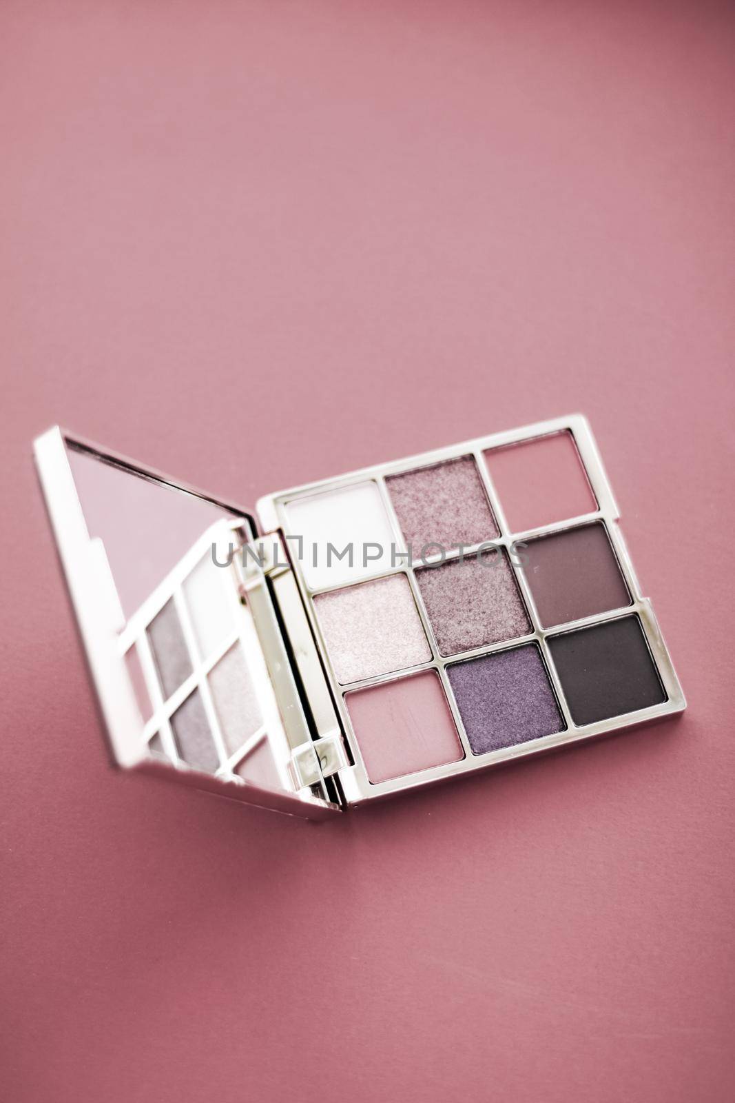 Cosmetic branding, mua and girly concept - Eyeshadow palette and make-up brush on rouge background, eye shadows cosmetics product for luxury beauty brand promotion and holiday fashion blog design