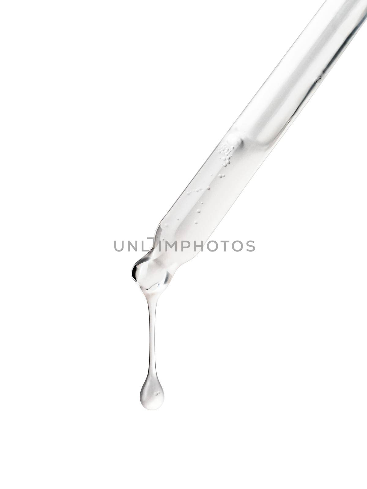 Clear essential serum oil dripping from dropper isolated on white background. Clipping path