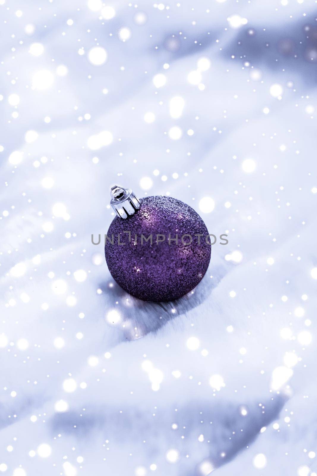 Violet Christmas baubles on fluffy fur with snow glitter, luxury winter holiday design background by Anneleven