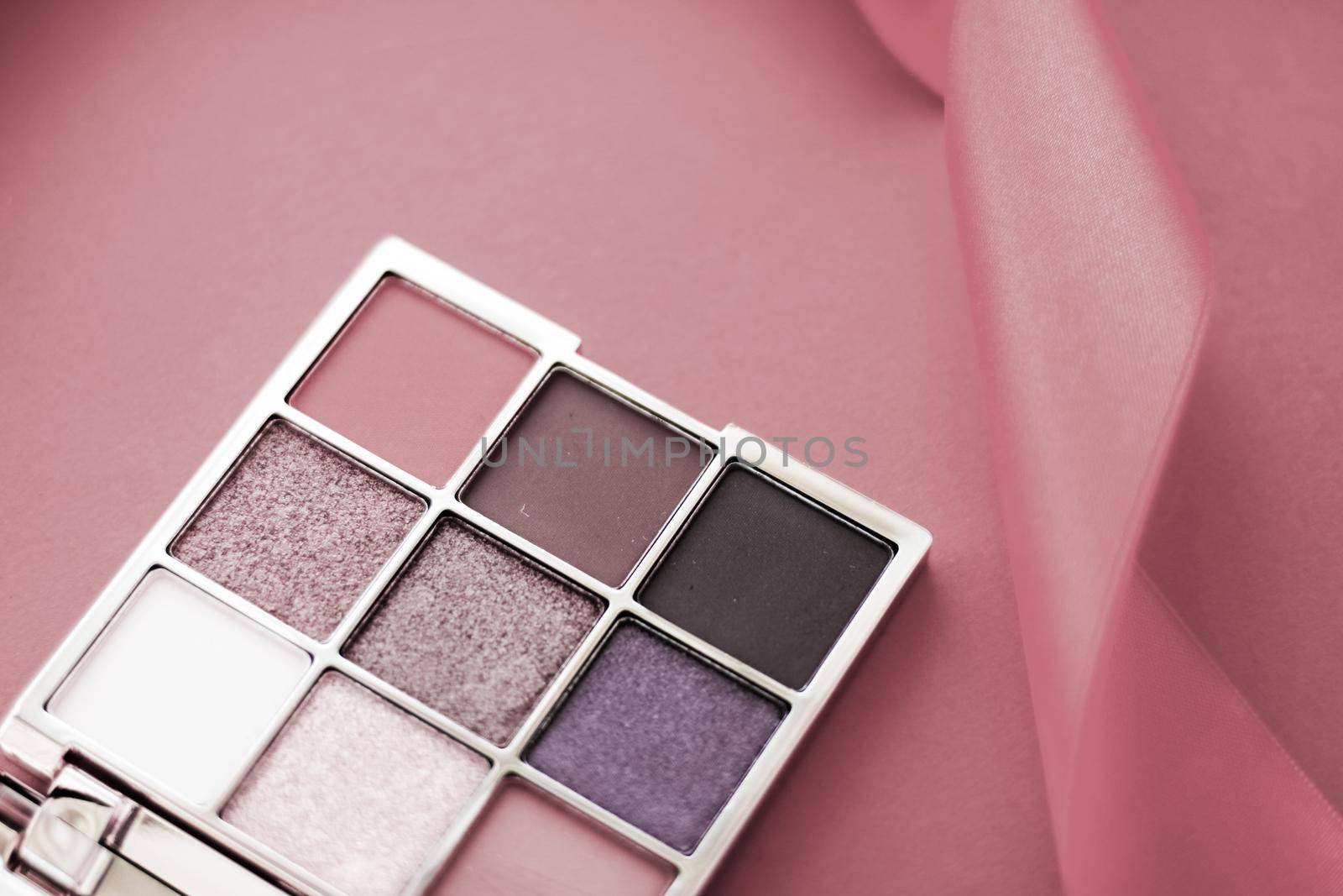 Eyeshadow palette and make-up brush on rouge background, eye shadows cosmetics product for luxury beauty brand promotion and holiday fashion blog design by Anneleven