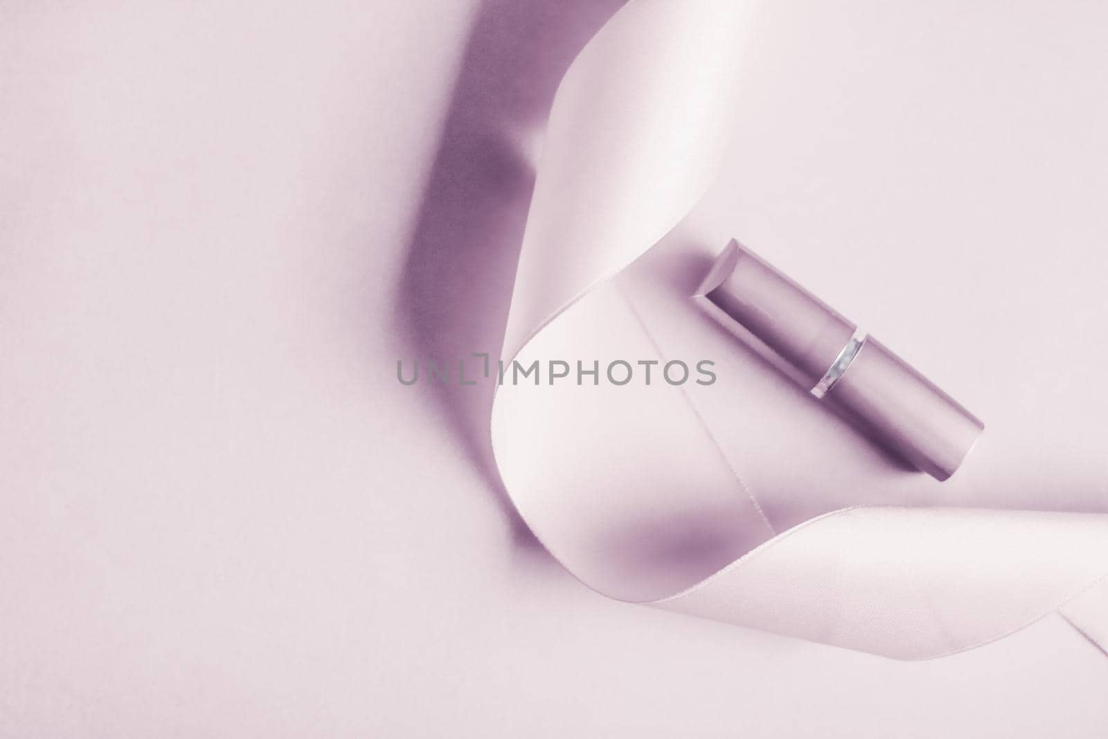 Cosmetic branding, glamour lip gloss and shopping sale concept - Luxury lipstick and silk ribbon on blush purple holiday background, make-up and cosmetics flatlay for beauty brand product design