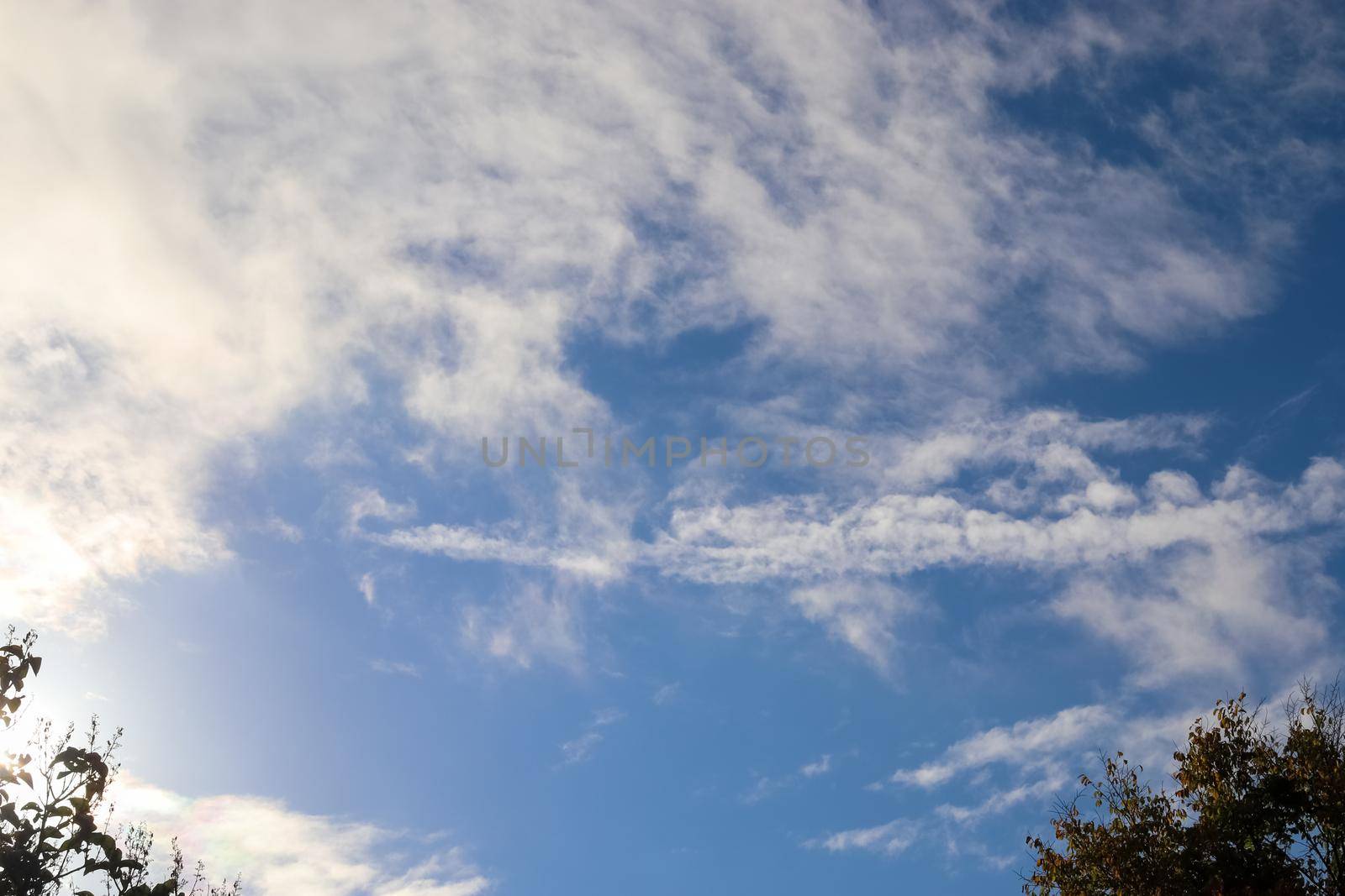 Beautiful fluffy white beautiful cloud formations in a deep blue summer sky