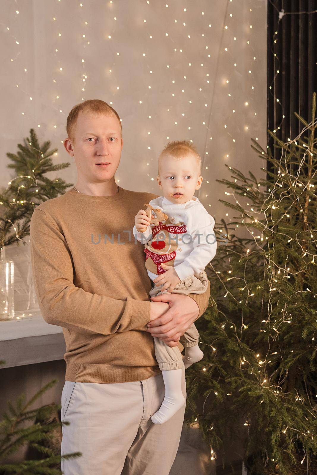 Dad and his little son in a magical Christmas atmosphere. The concept of family relations and New Year celebrations. by Annu1tochka