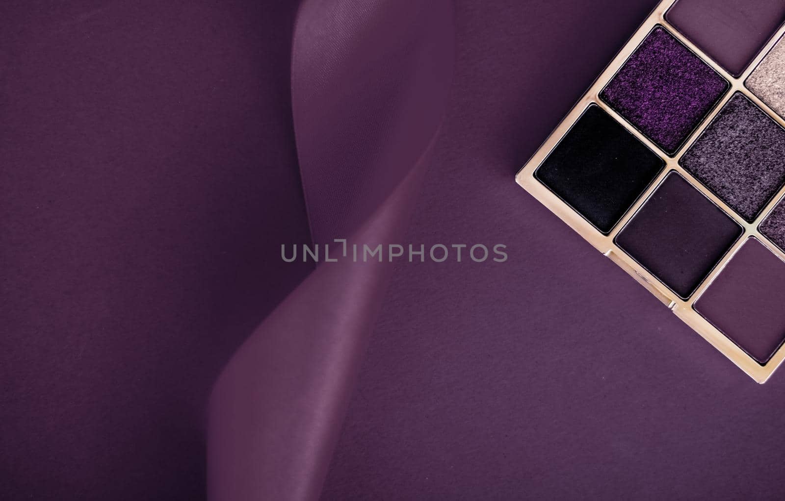 Cosmetic branding, mua and girly concept - Eyeshadow palette and make-up brush on purple background, eye shadows cosmetics product as luxury beauty brand promotion and holiday fashion blog design