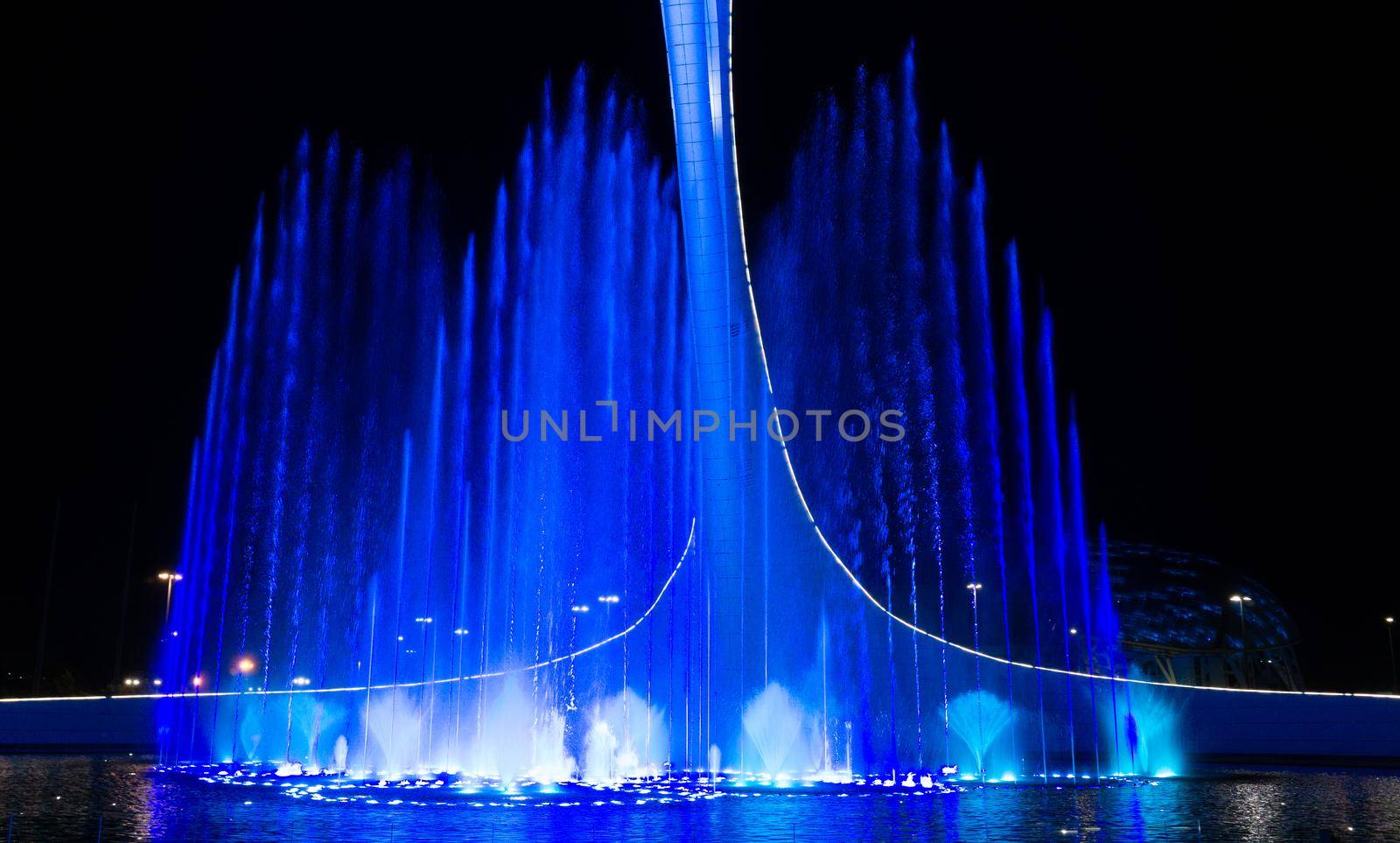 SOCHI, RUSSIA - JUNE, 05, 2021: The Waters of the Sochi Park, Water night show accompanied by classical music by Asnia