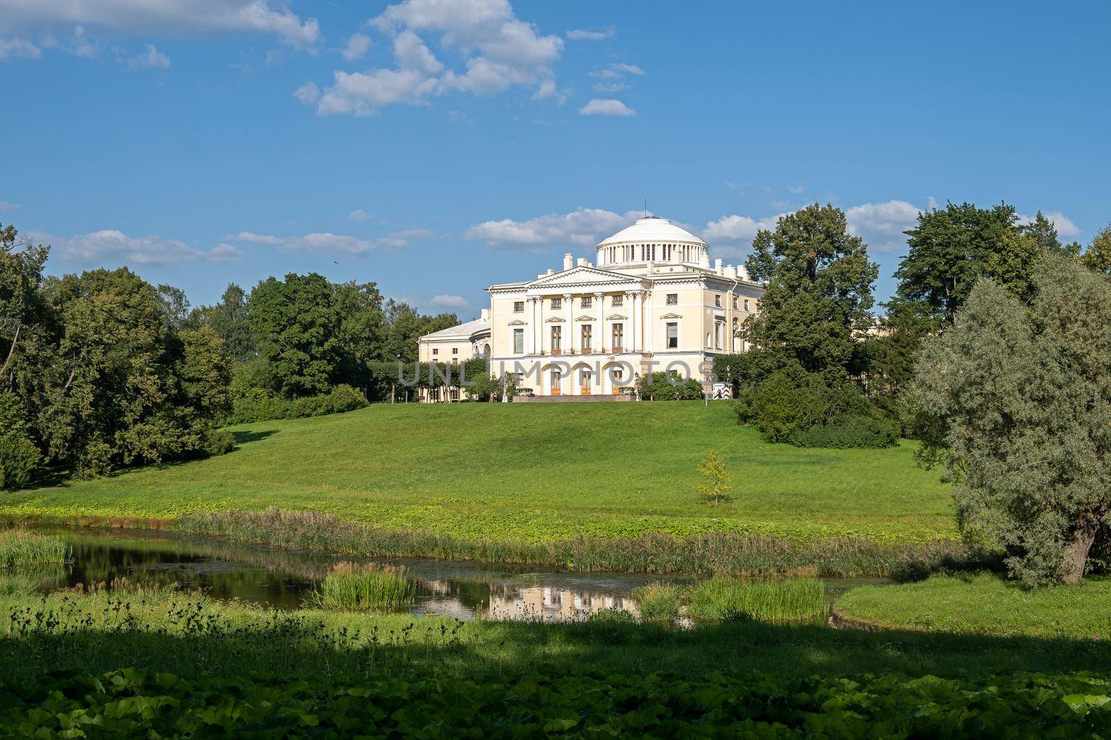 Pavlovsk, St. Petersburg, Russia - September 20, 2002. View of the Pavlovsk Palace on the banks of the Slavyanka River in the Pavlovsk State Museum-Reserve. Selective focus...