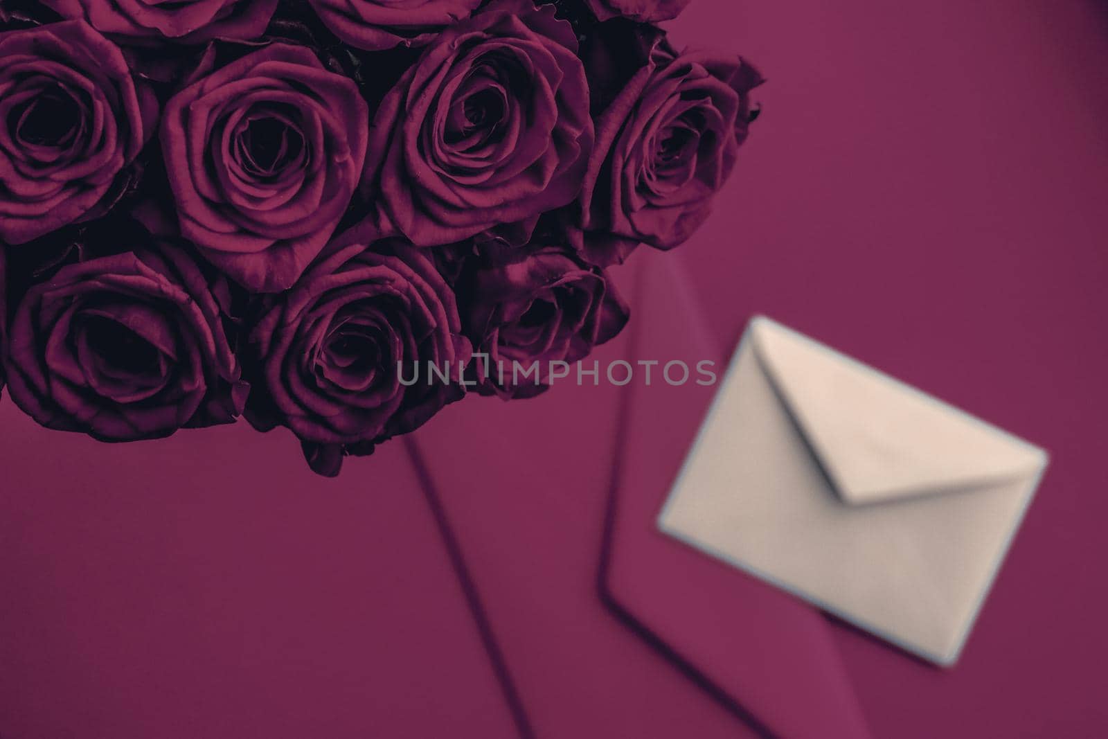 Holidays gift, floral present and happy relationship concept - Love letter and flowers delivery on Valentines Day, luxury bouquet of roses and card on wine background for romantic holiday design