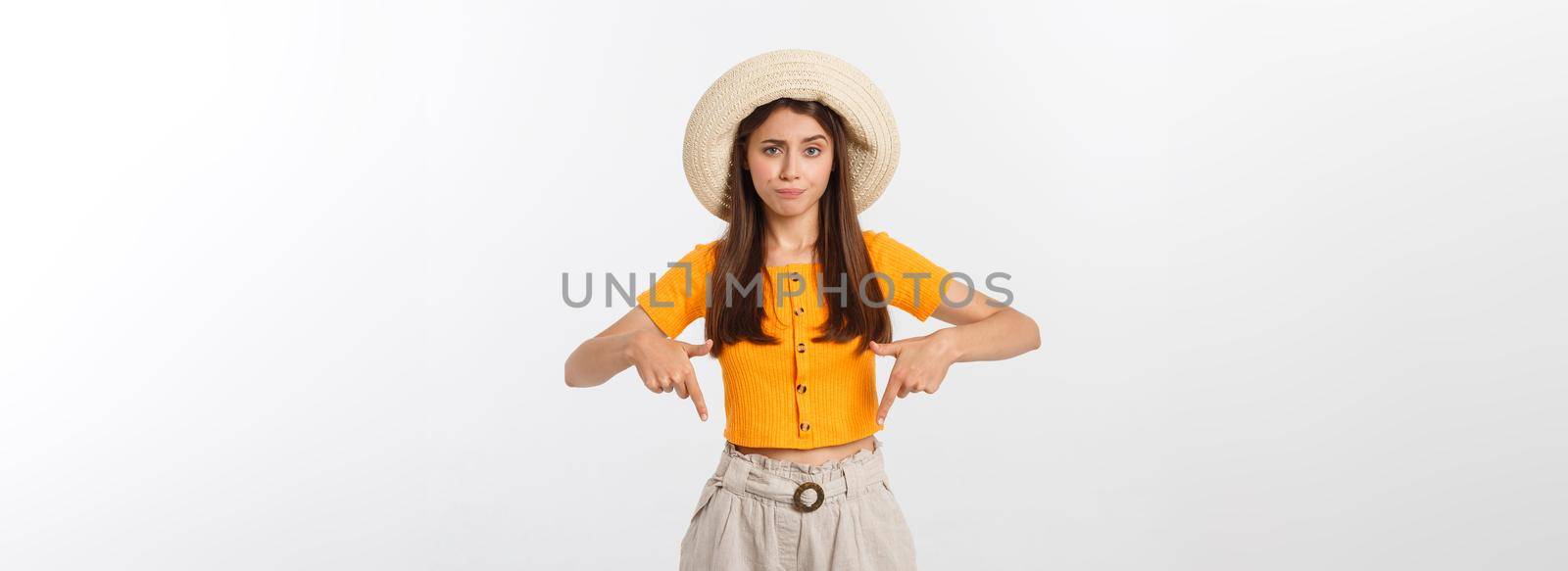 young pretty woman looking unhappy and stressed, suicide gesture making gun sign with hand, pointing to copy space. by Benzoix