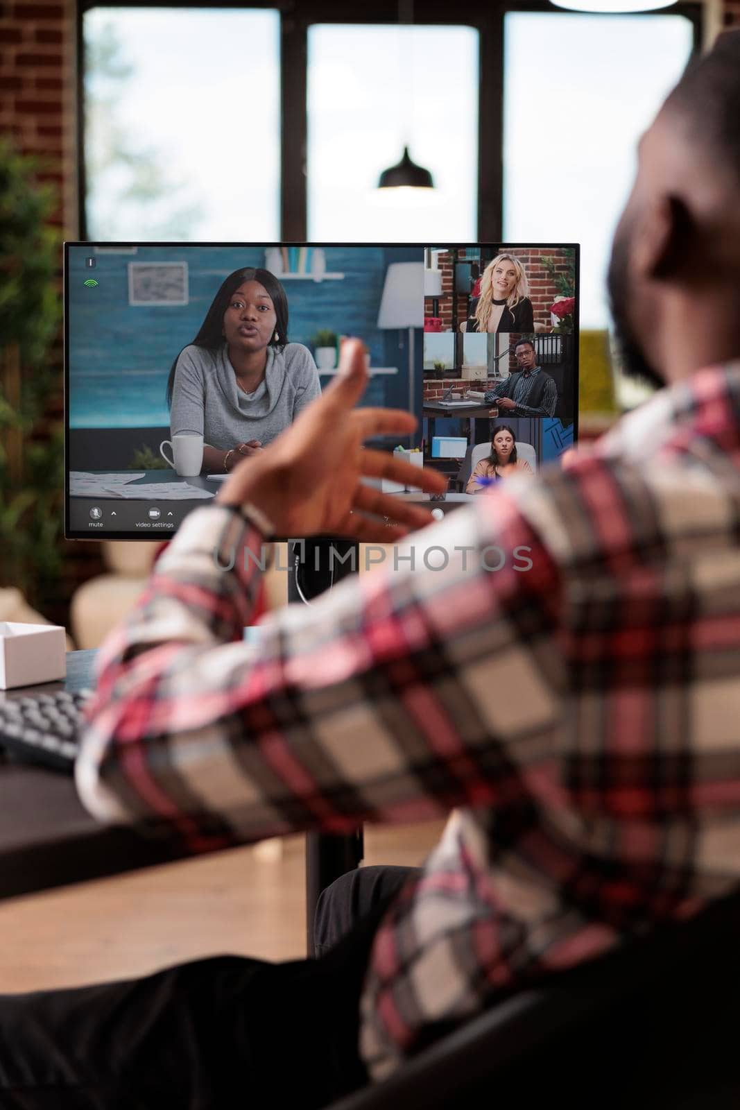 Office employee talking on online videoconference by DCStudio