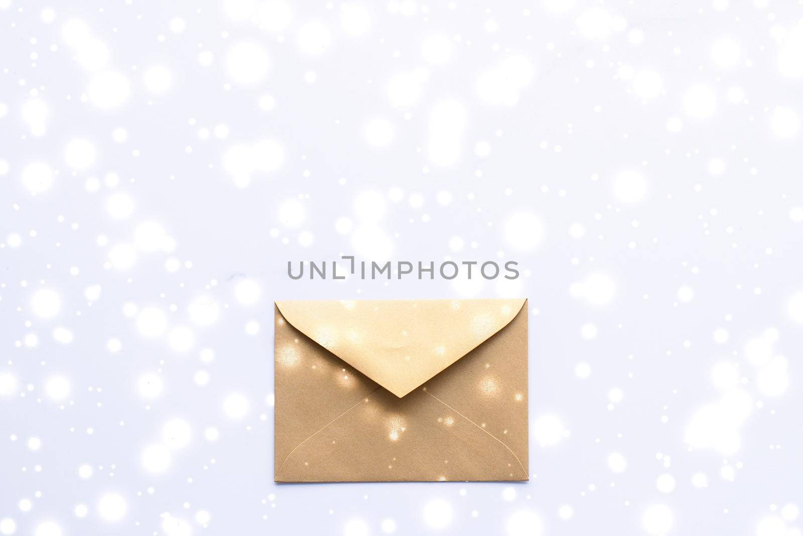 Winter holiday blank paper envelopes on marble with shiny snow flatlay background, love letter or Christmas mail card design by Anneleven