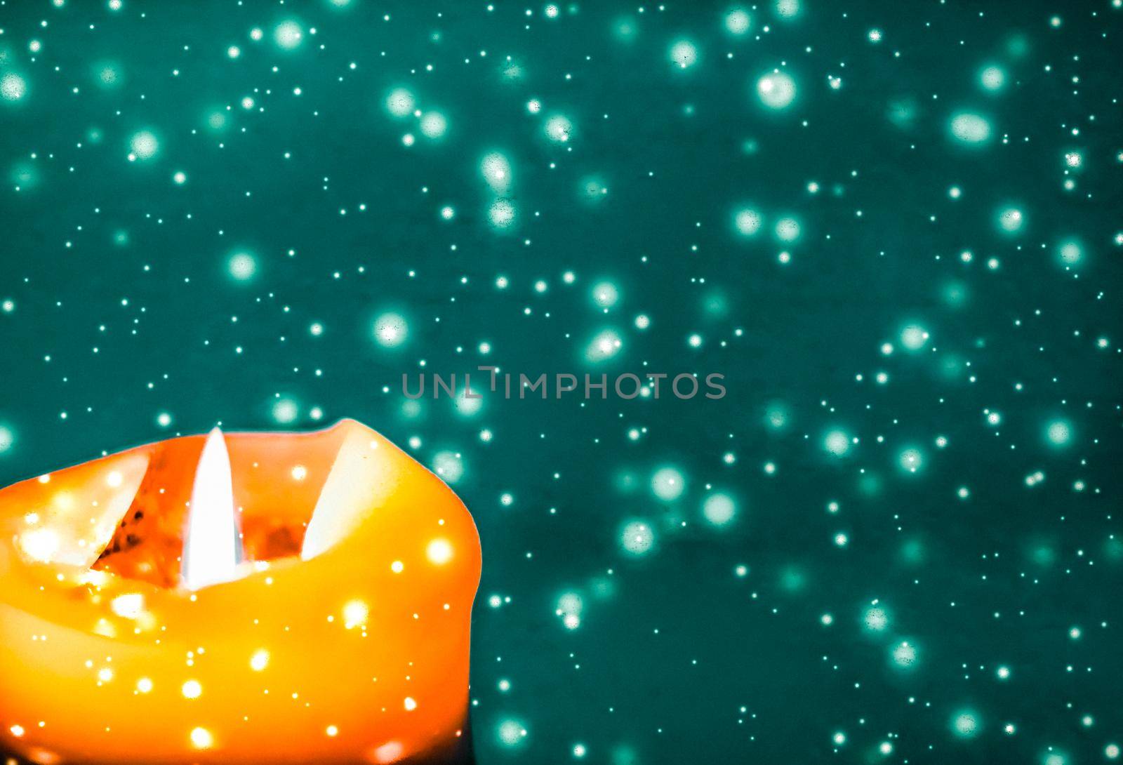 Orange holiday candle on green sparkling snowing background, luxury branding design for Halloween, New Years Eve and Christmas by Anneleven