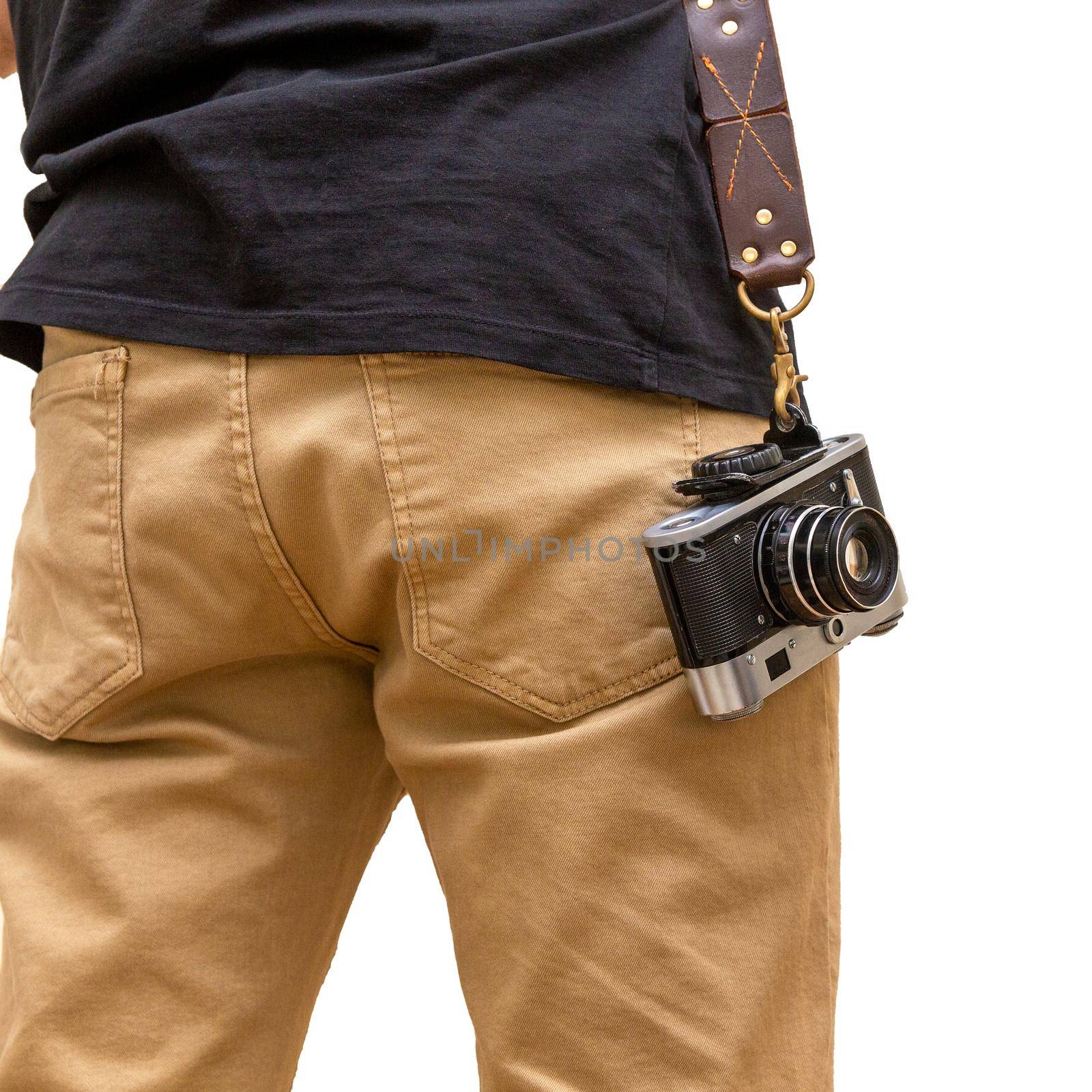 Man is standing backwards with brown hand made natural leather camera shoulder strap isolated on a white background. Photographer equipment, stylish, vintage, retro feel. Clipping path.