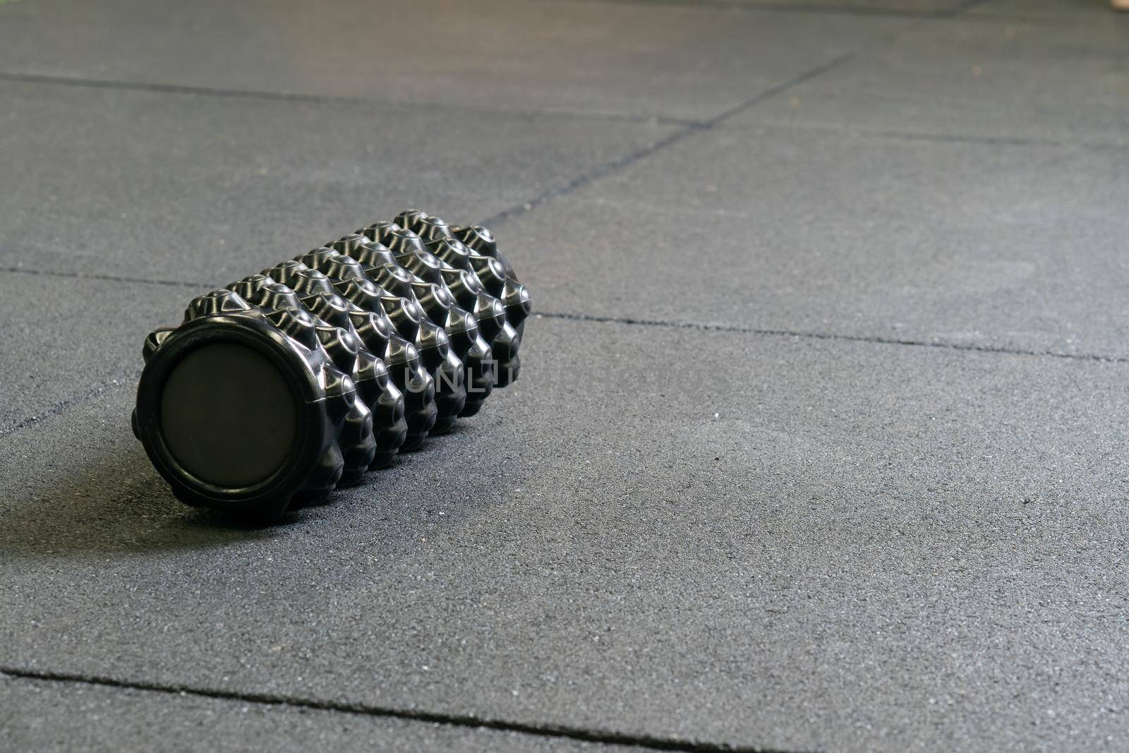 Black foam athletic roller massage exercise sport body training, concept active indoor from pilates from cylinder fascia, muscular room. Therapy , by 89167702191