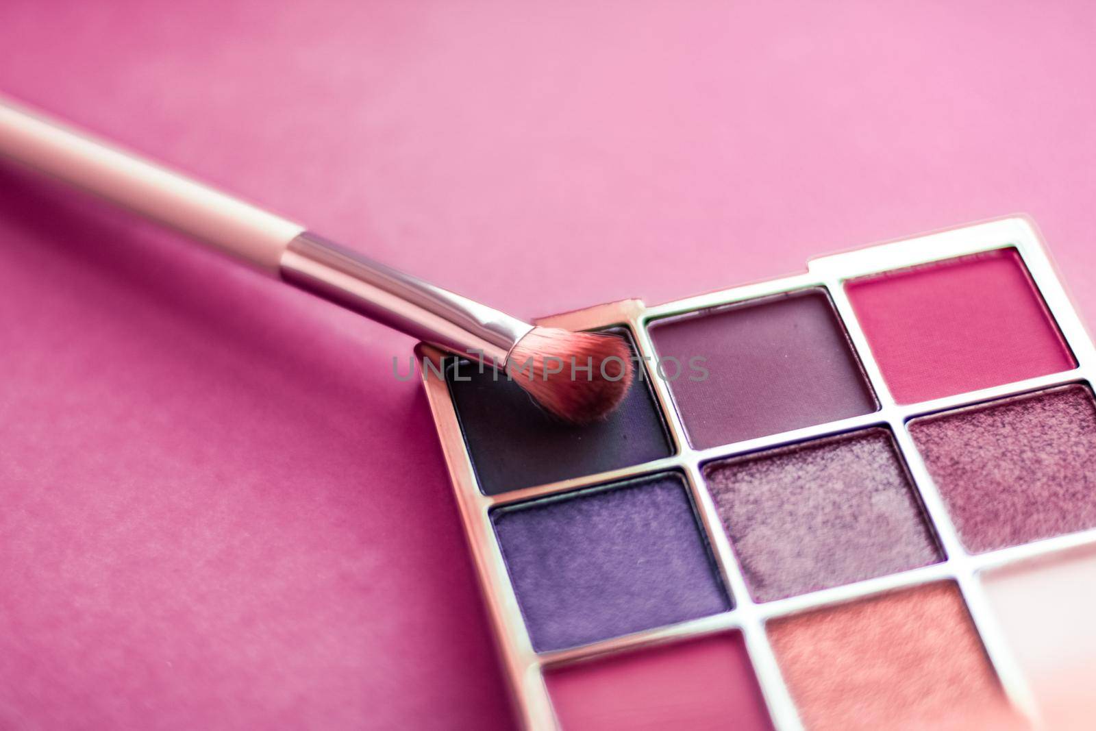 Eyeshadow palette and make-up brush on pink background, eye shadows cosmetics product as luxury beauty brand promotion and holiday fashion blog design by Anneleven
