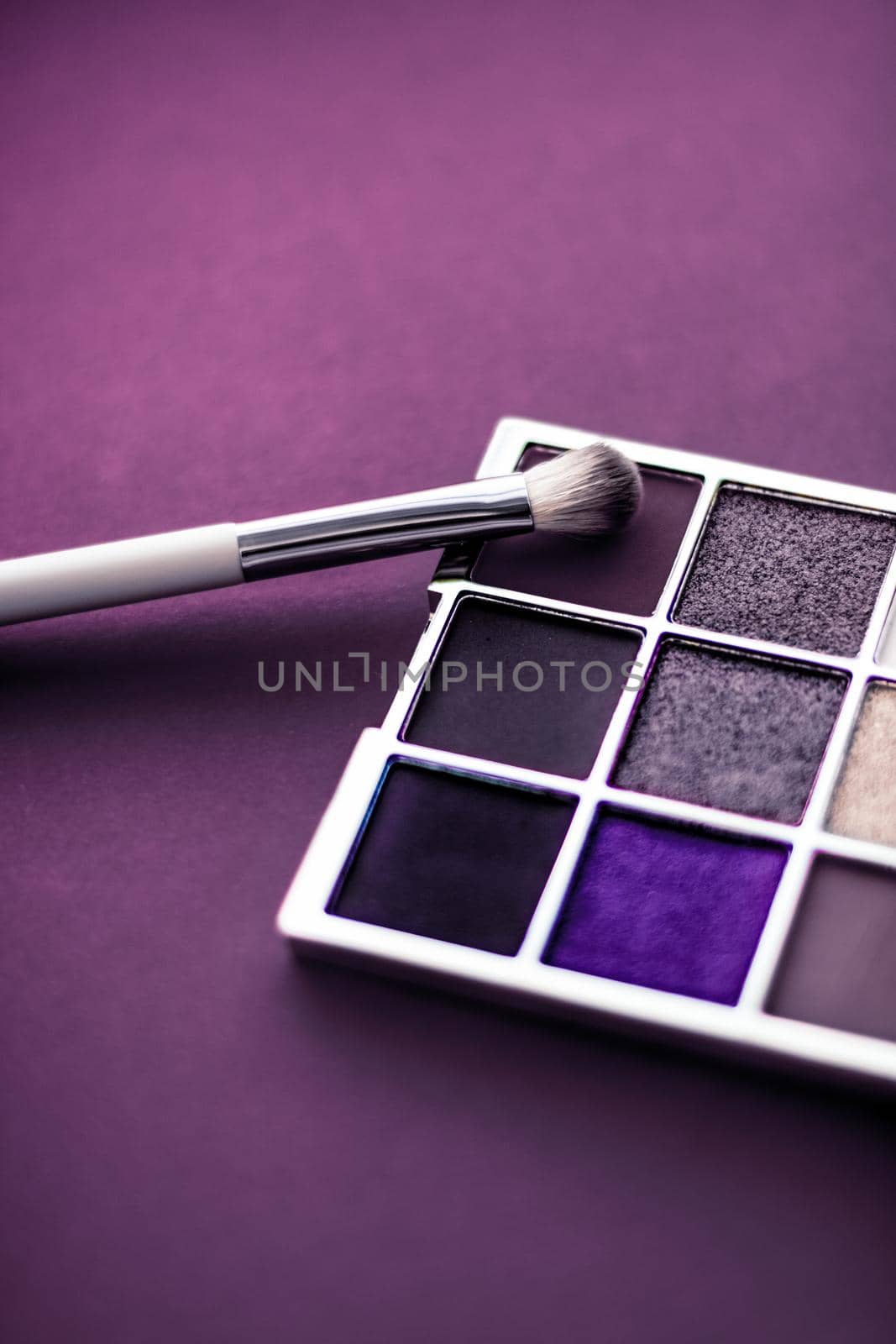 Eyeshadow palette and make-up brush on purple background, eye shadows cosmetics product as luxury beauty brand promotion and holiday fashion blog design by Anneleven
