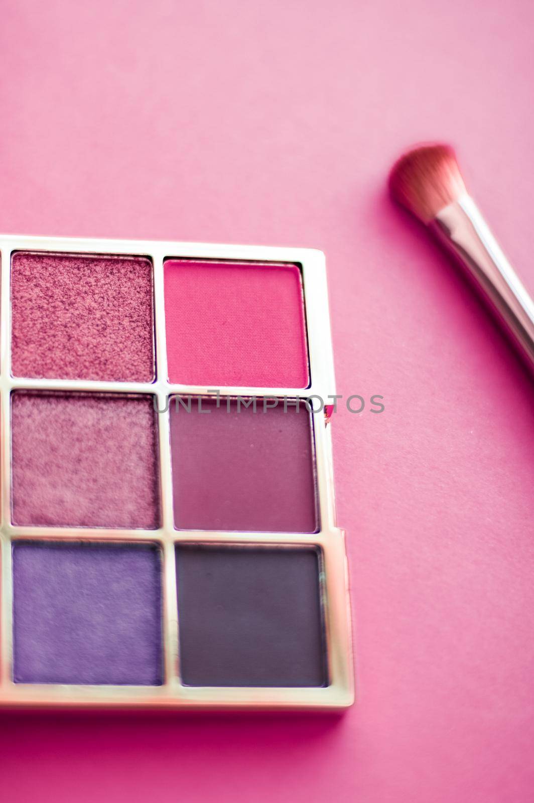 Eyeshadow palette and make-up brush on pink background, eye shadows cosmetics product as luxury beauty brand promotion and holiday fashion blog design by Anneleven