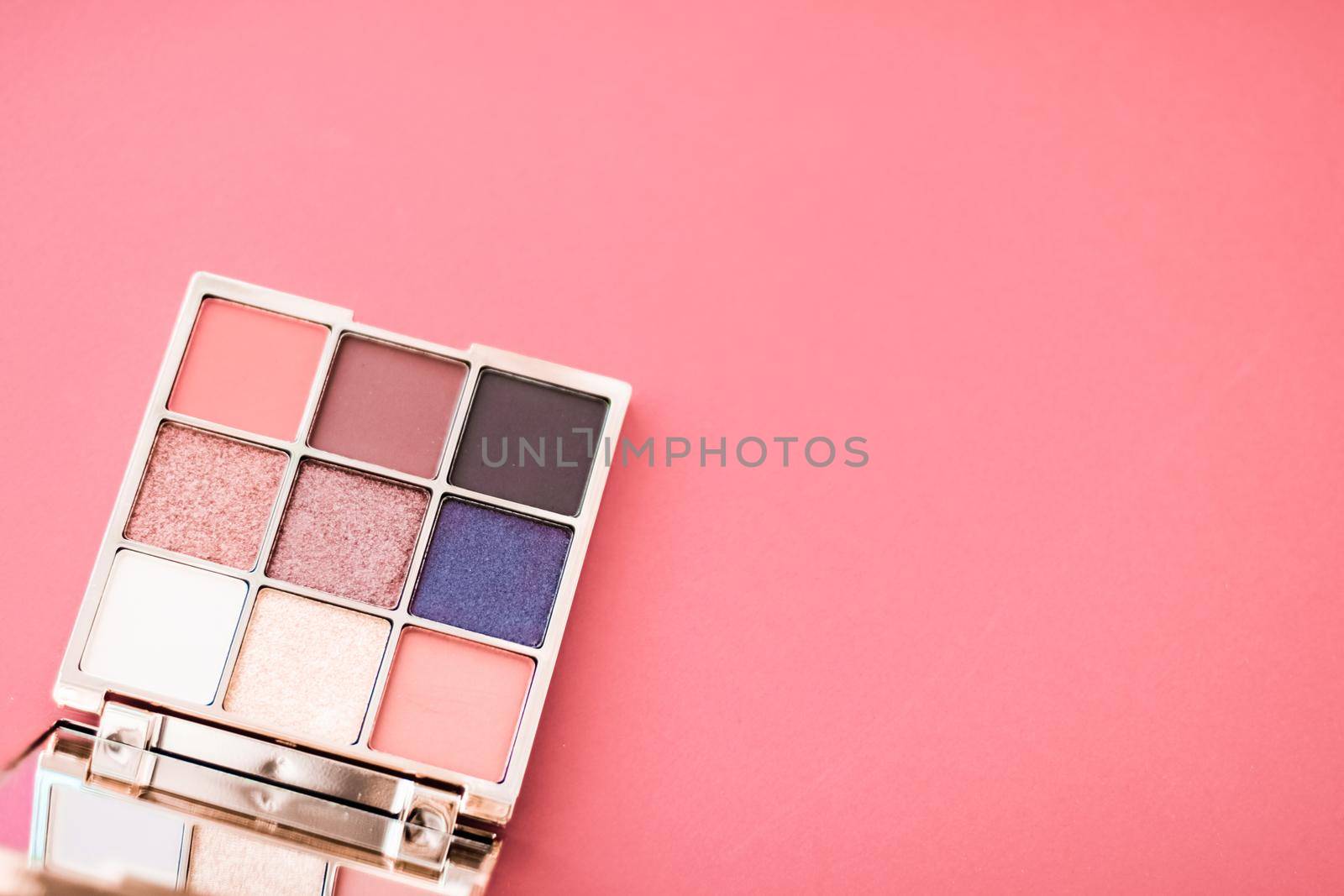 Cosmetic branding, mua and girly concept - Eyeshadow palette and make-up brush on coral background, eye shadows cosmetics product for luxury beauty brand promotion and holiday fashion blog design