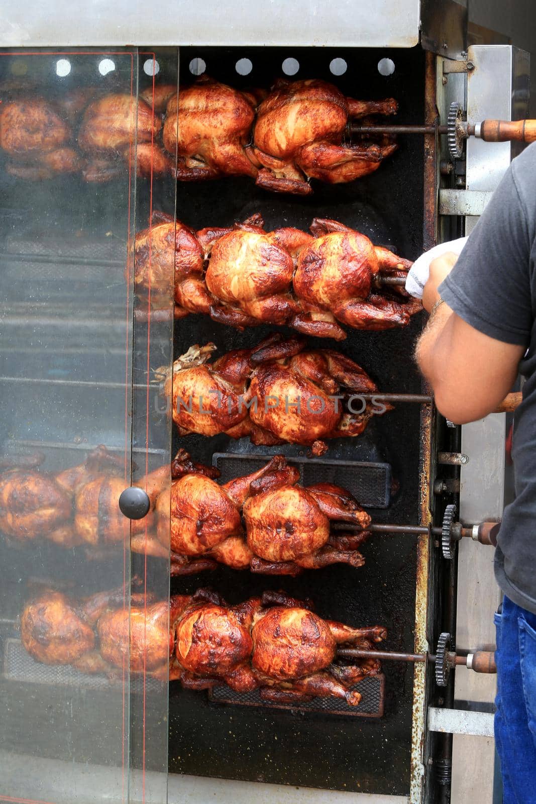 roast chicken in a street restaurant by joasouza