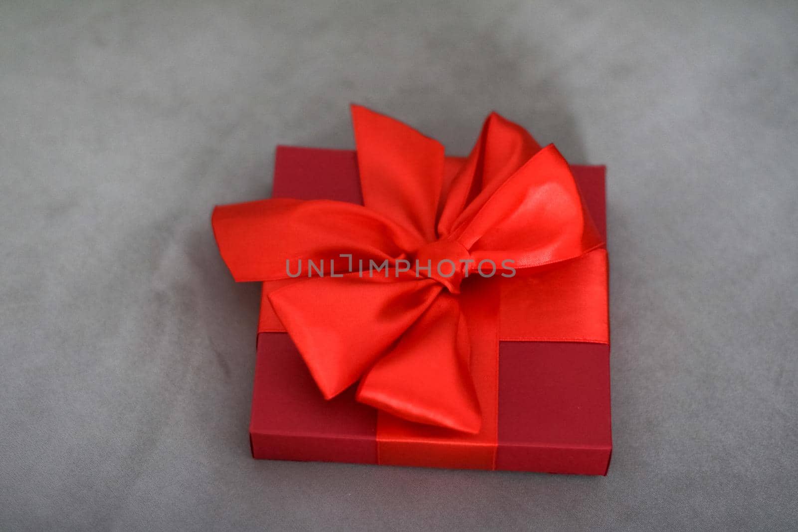 Wedding present, shop sale promotion and love celebration concept - Luxury holiday red gift box with silk ribbon and bow, christmas or valentines day decor