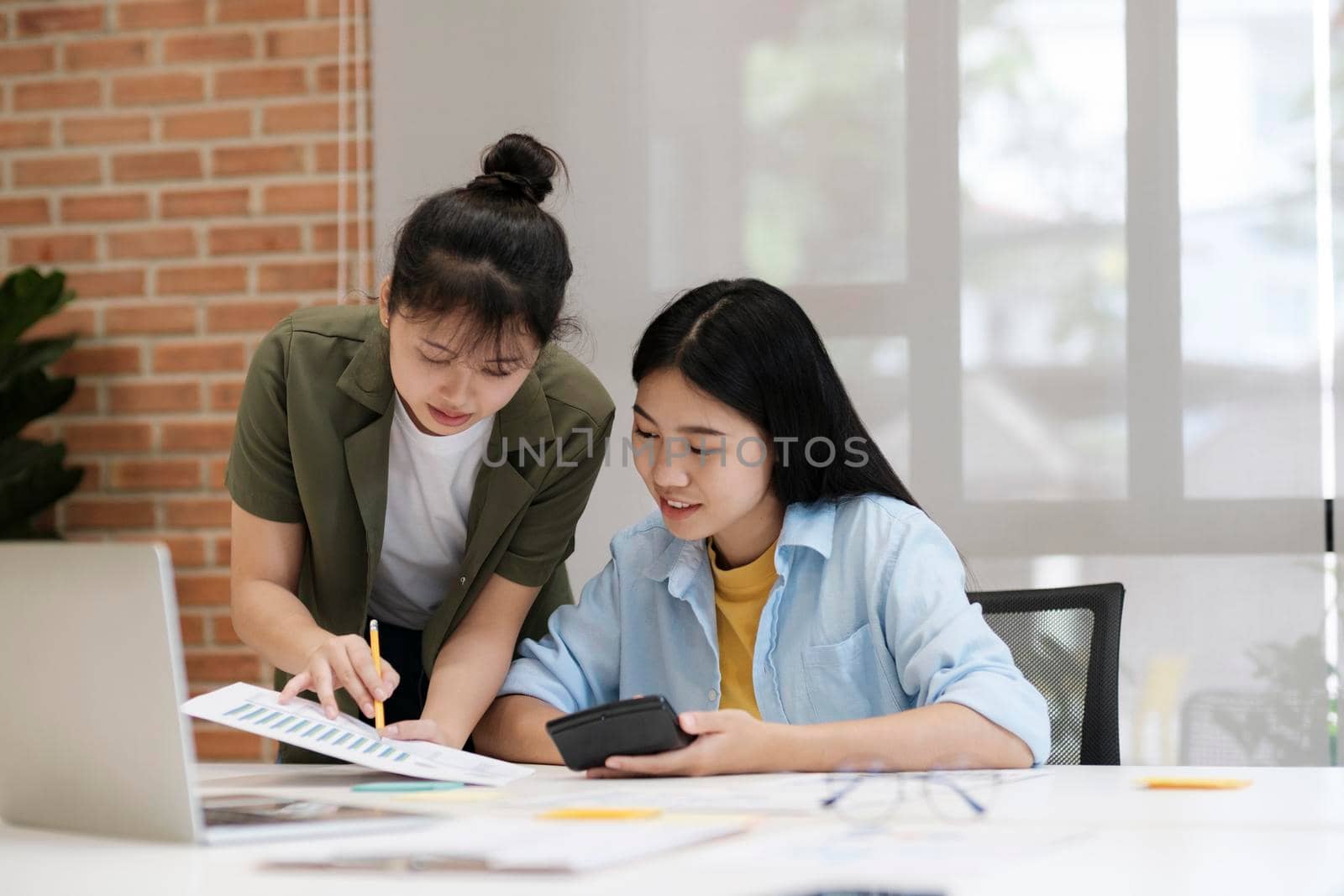 Startup asian business teamwork analyse investment marketing data on computer laptop, finance meeting.