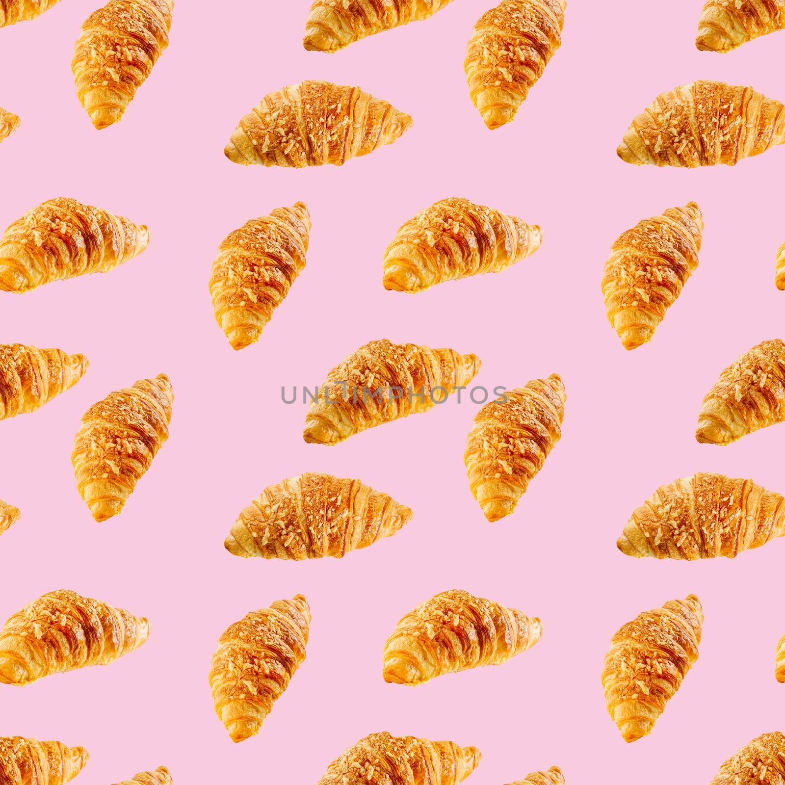 seamless pattern made from Fresh croissant isolated on pink background. Bakery pattern with baked croissant with cheese.