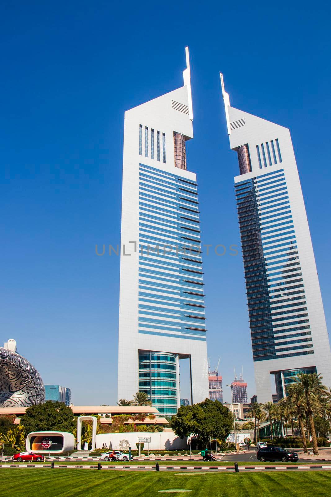 Dubai, UAE - 02.04.2021 Shot of a very well known landmark in Dabai, Emirates towers. Outdoors by pazemin