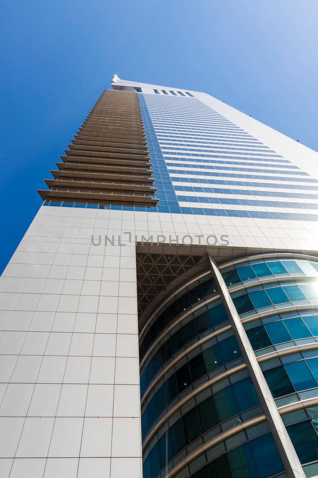 Dubai, UAE - 02.04.2021 Shot of a very well known landmark in Dabai, Emirates towers. Outdoors by pazemin