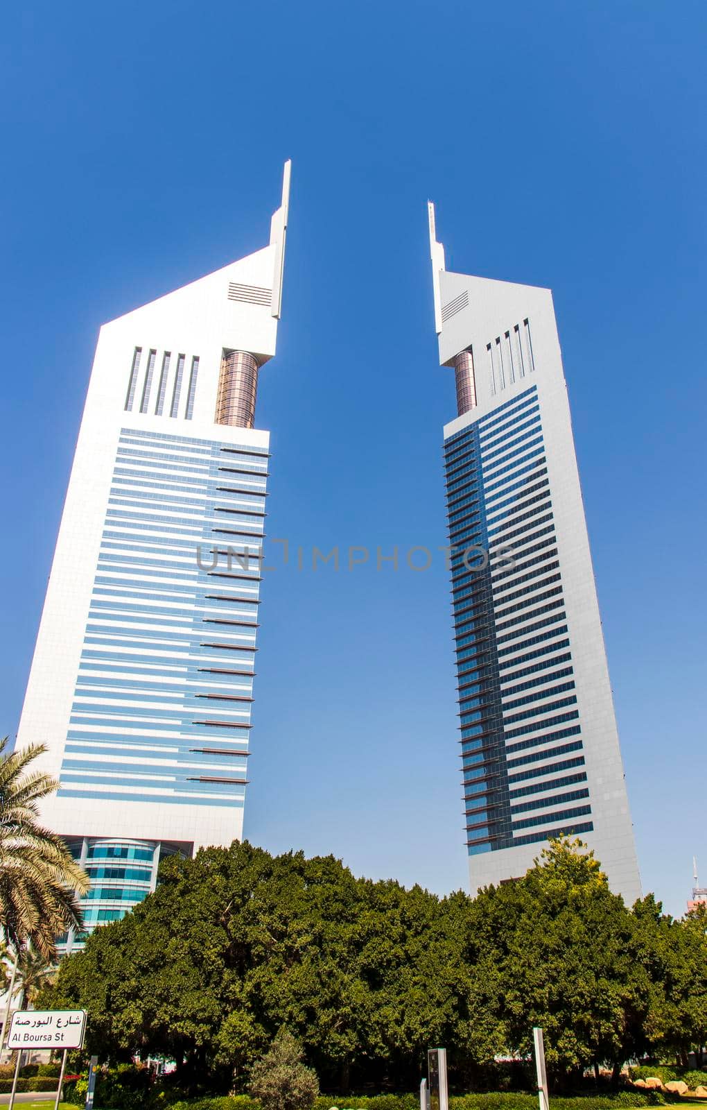 Dubai, UAE - 02.04.2021 Shot of a very well known landmark in Dabai, Emirates towers. Outdoors by pazemin