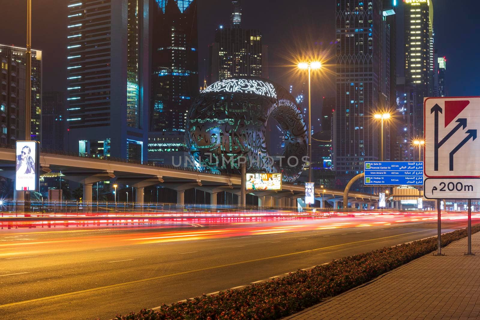 Dubai,UAE - 05.18.2021 Main road of a United Arab Emirates, Shekh Zayed road.Many of famous buildings can be seen as well as metro station and Museum of future.