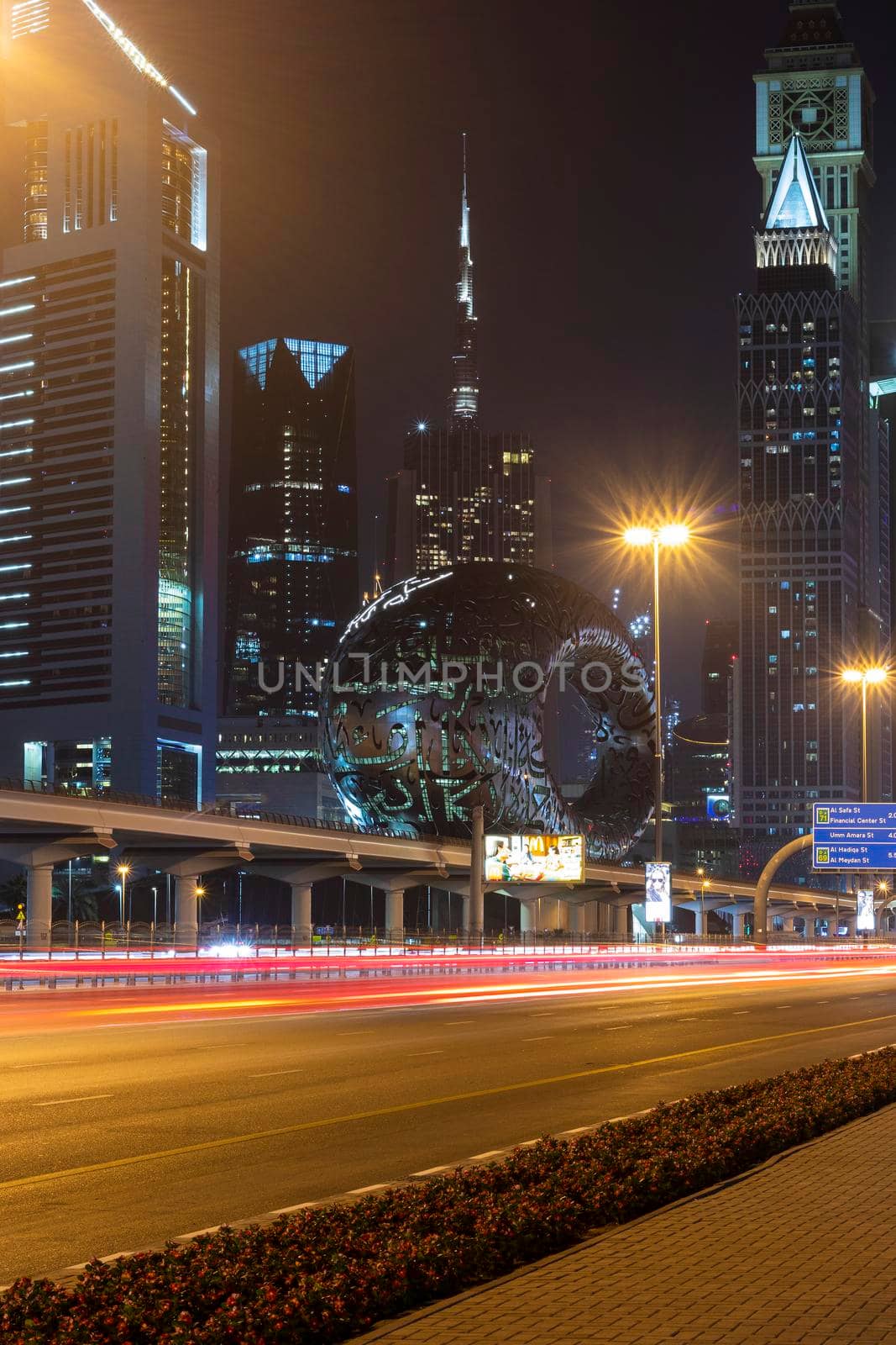 Dubai,UAE - 05.18.2021 Main road of a United Arab Emirates, Shekh Zayed road.Many of famous buildings can be seen as well as metro station and Museum of future.