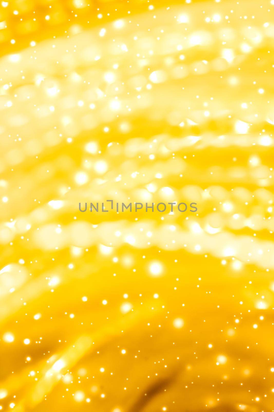 Golden Christmas lights, New Years Eve fireworks and abstract texture concept - Glamorous gold shiny glow and glitter, luxury holiday background