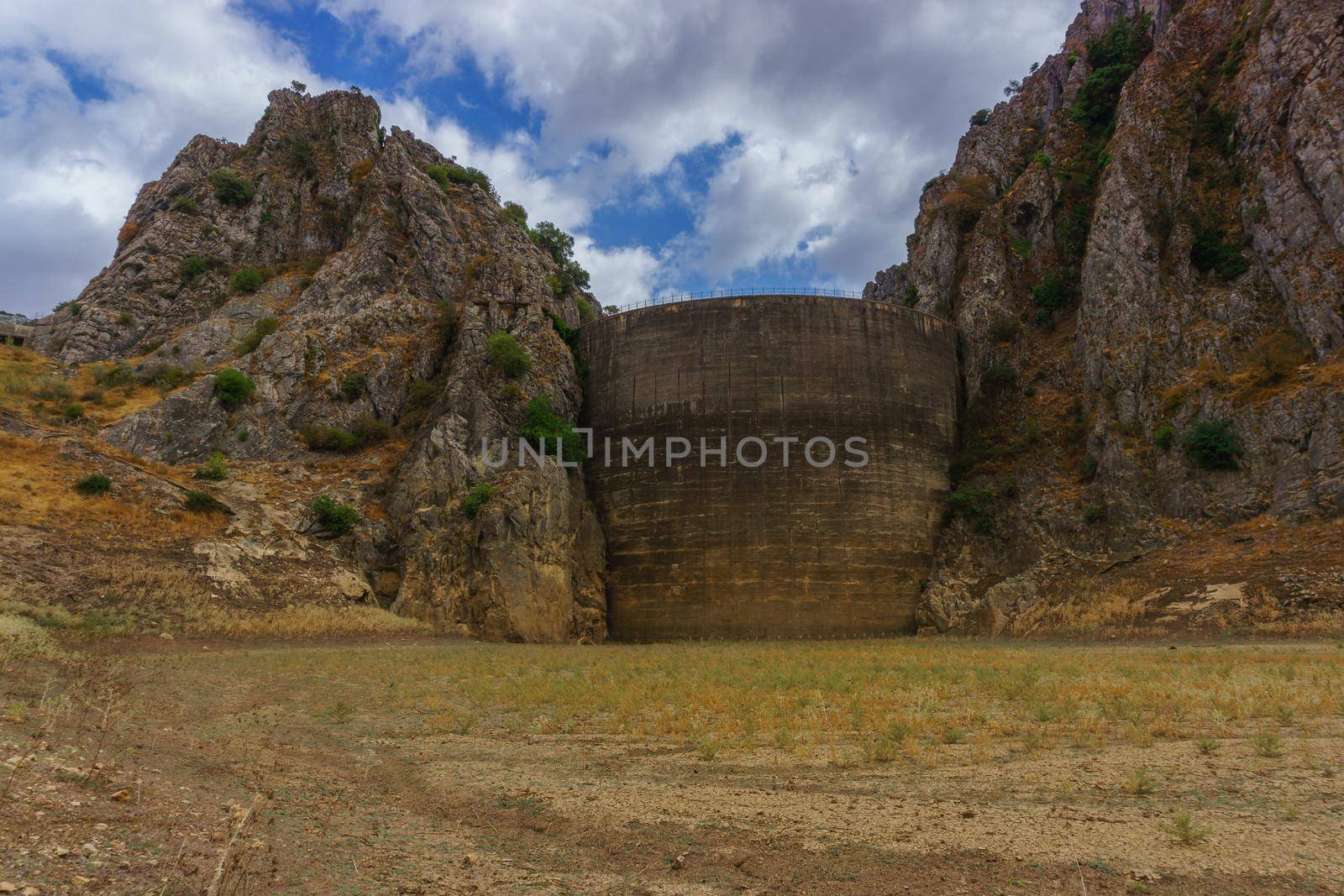 meadow at the bottom of the dry swamp drought emergency for climate change by joseantona