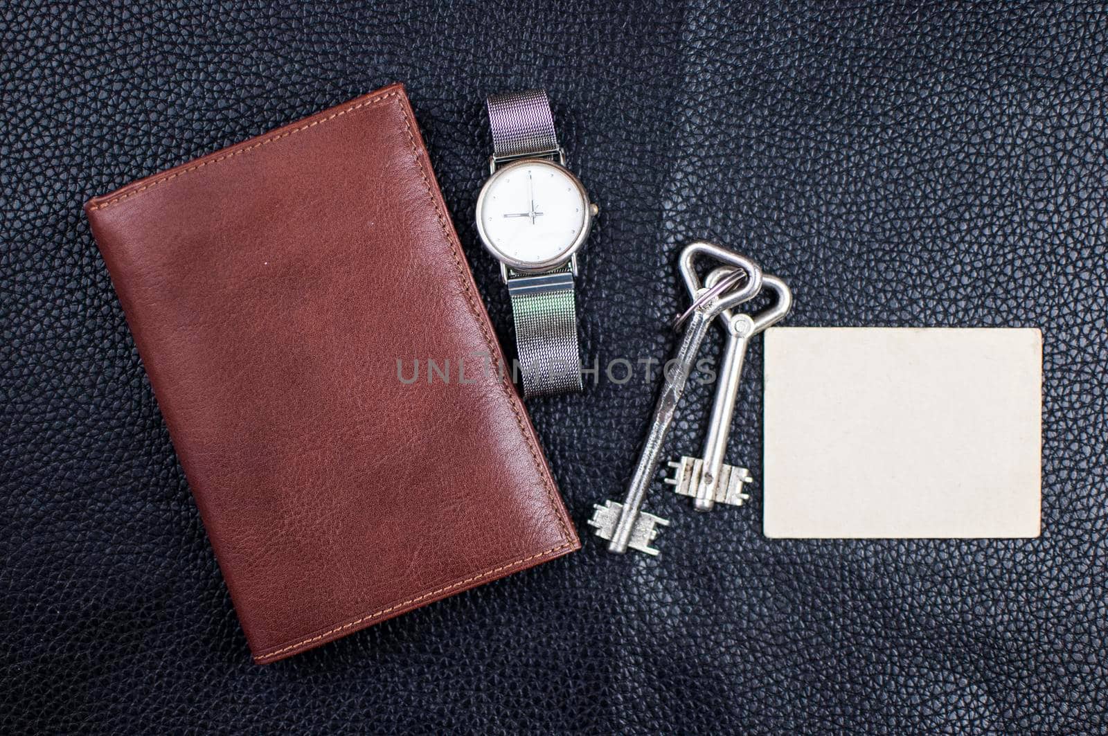 brown leather men purse on black leather background by inxti