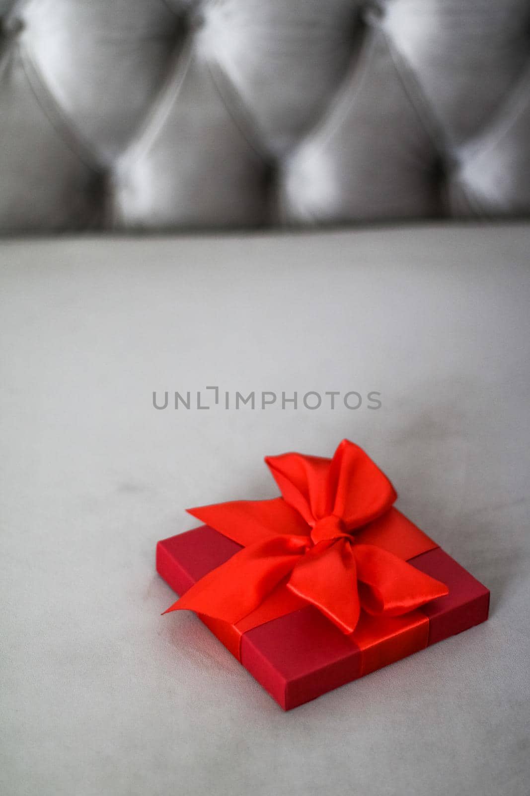 Wedding present, shop sale promotion and love celebration concept - Luxury holiday red gift box with silk ribbon and bow, christmas or valentines day decor