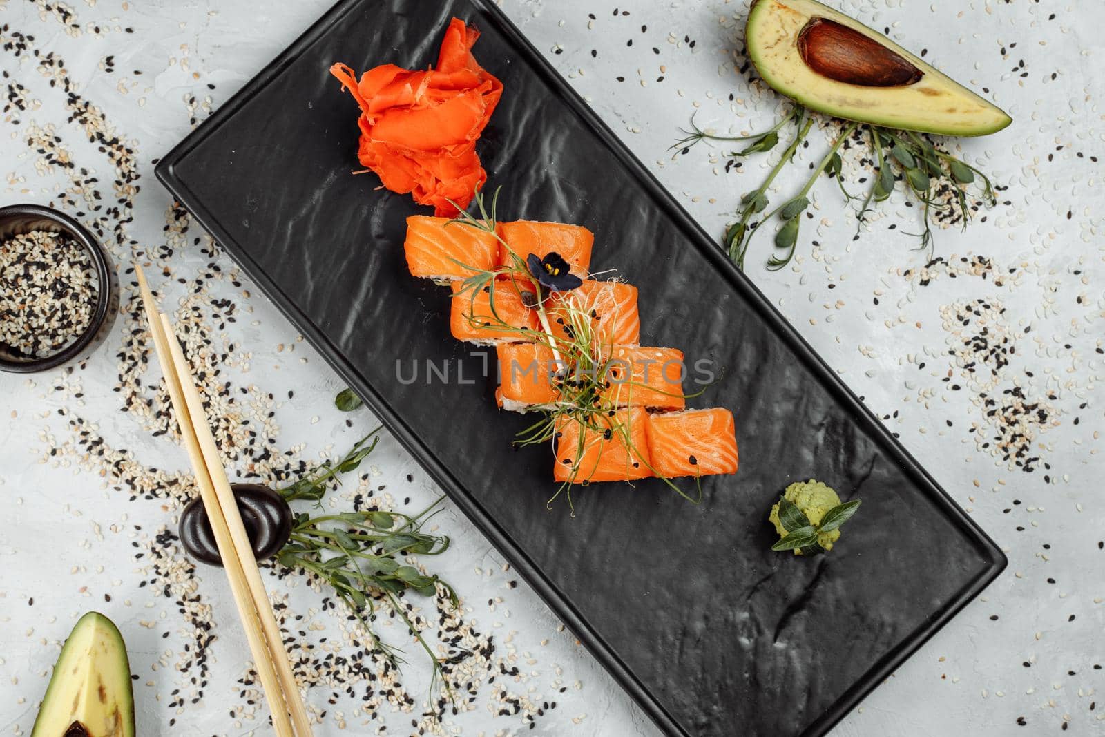 Sushi Philadelphia on a stone decorative plate.