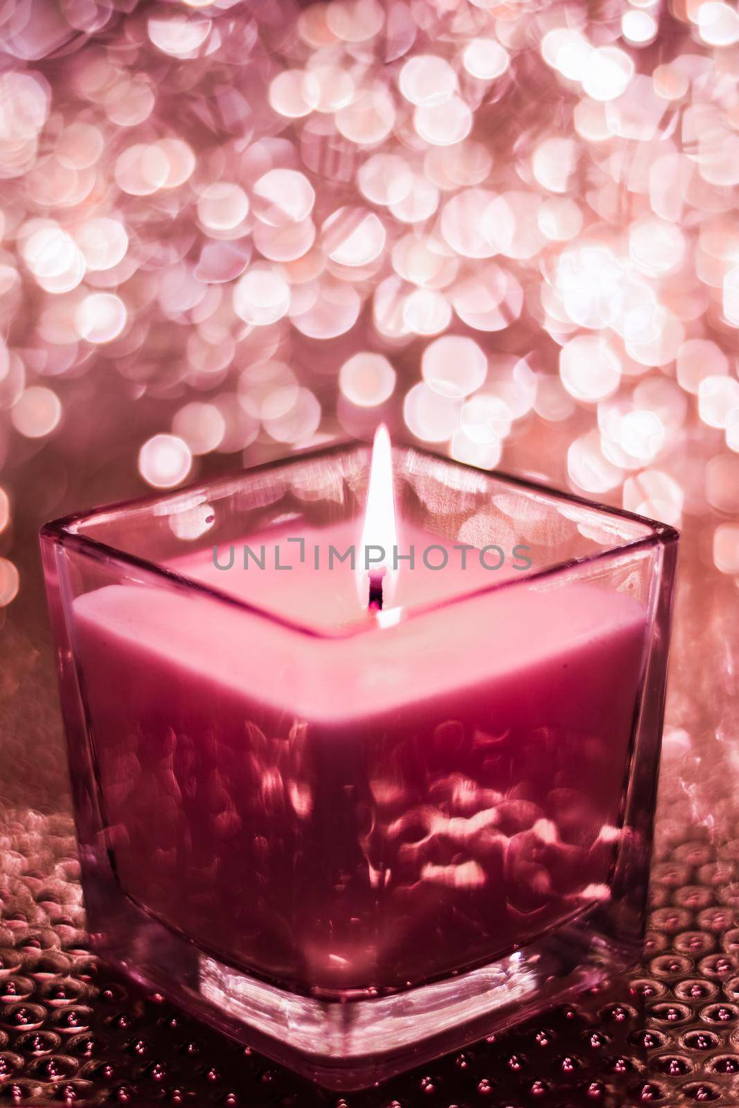 Festive decoration, branding and aromatherapy spa concept - Red aromatic candle on Christmas and New Years glitter background, Valentines Day luxury home decor and holiday season brand design