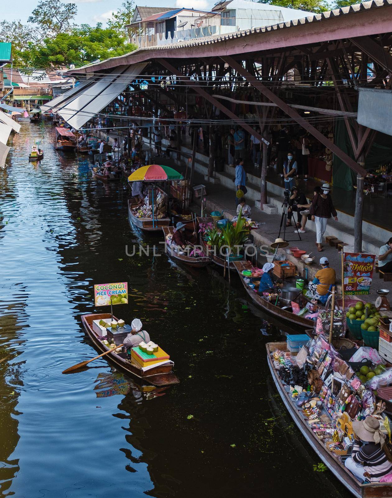 People at Damnoen saduak floating market, Bangkok Thailand. colorful floating market in Thailand